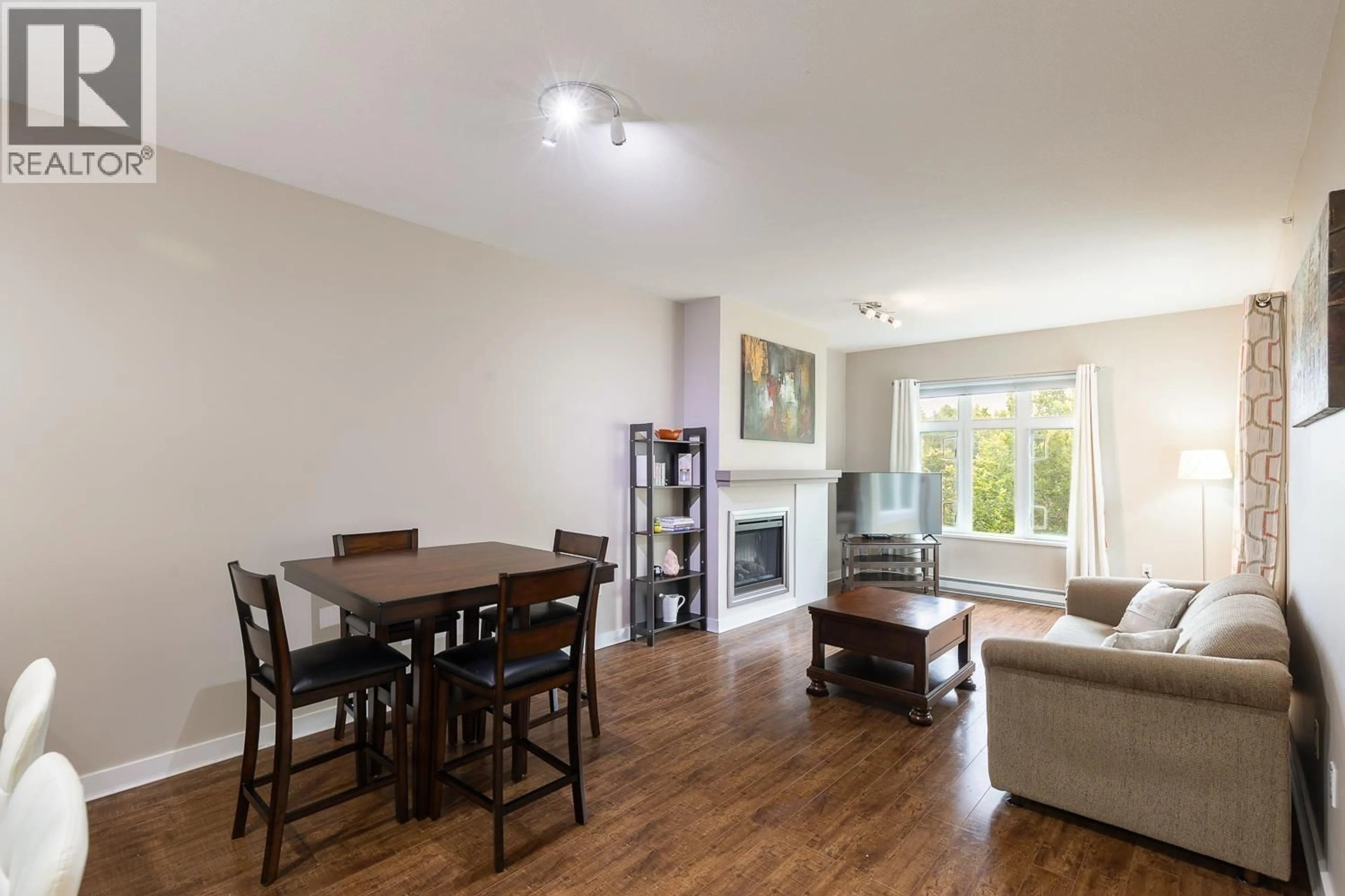Living room with furniture, wood/laminate floor for 405 - 2368 MARPOLE AVENUE, Port Coquitlam British Columbia V3C0B4