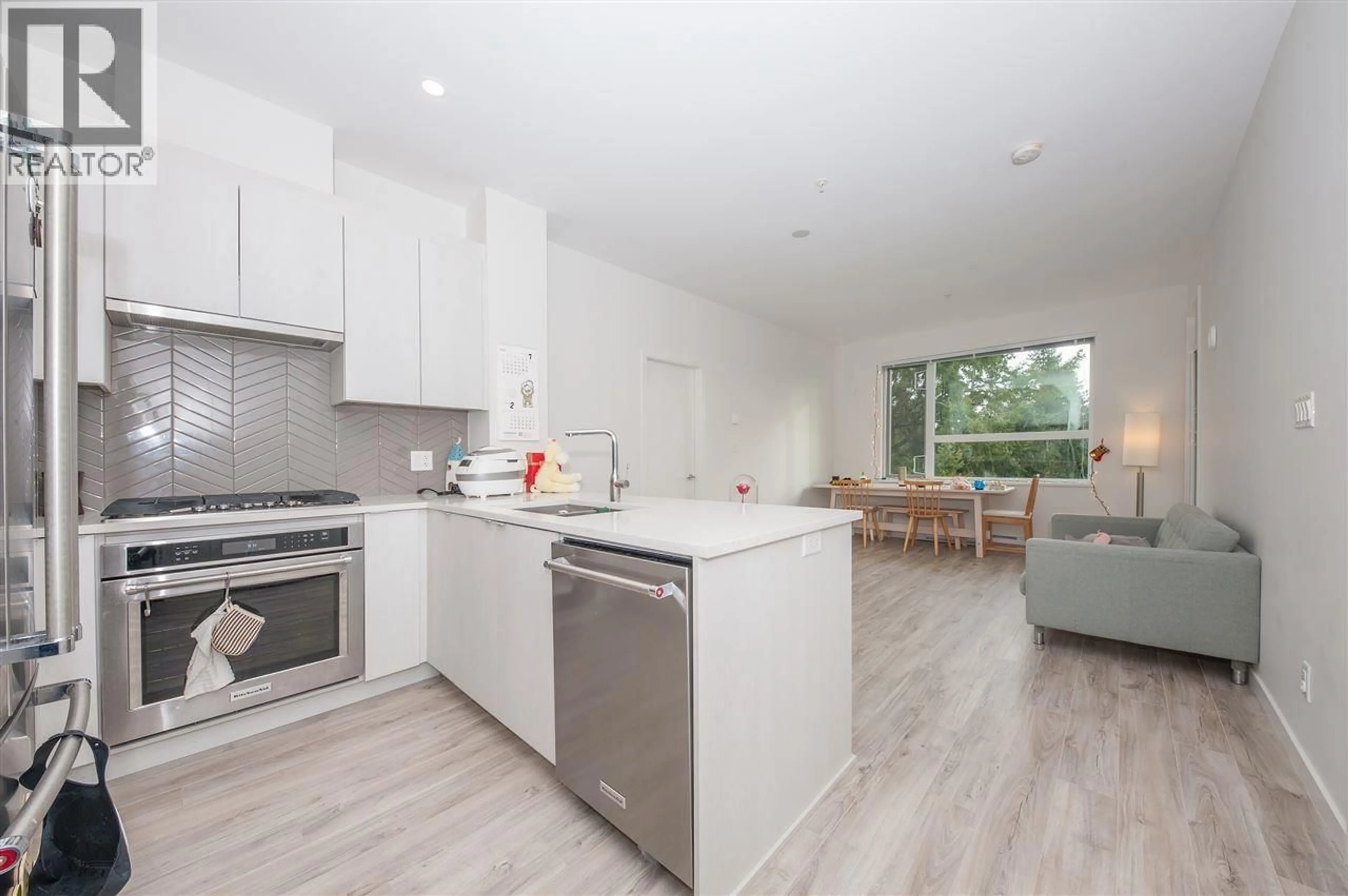 Open concept kitchen, wood/laminate floor for 603 - 717 BRESLAY STREET, Coquitlam British Columbia V3J0J3
