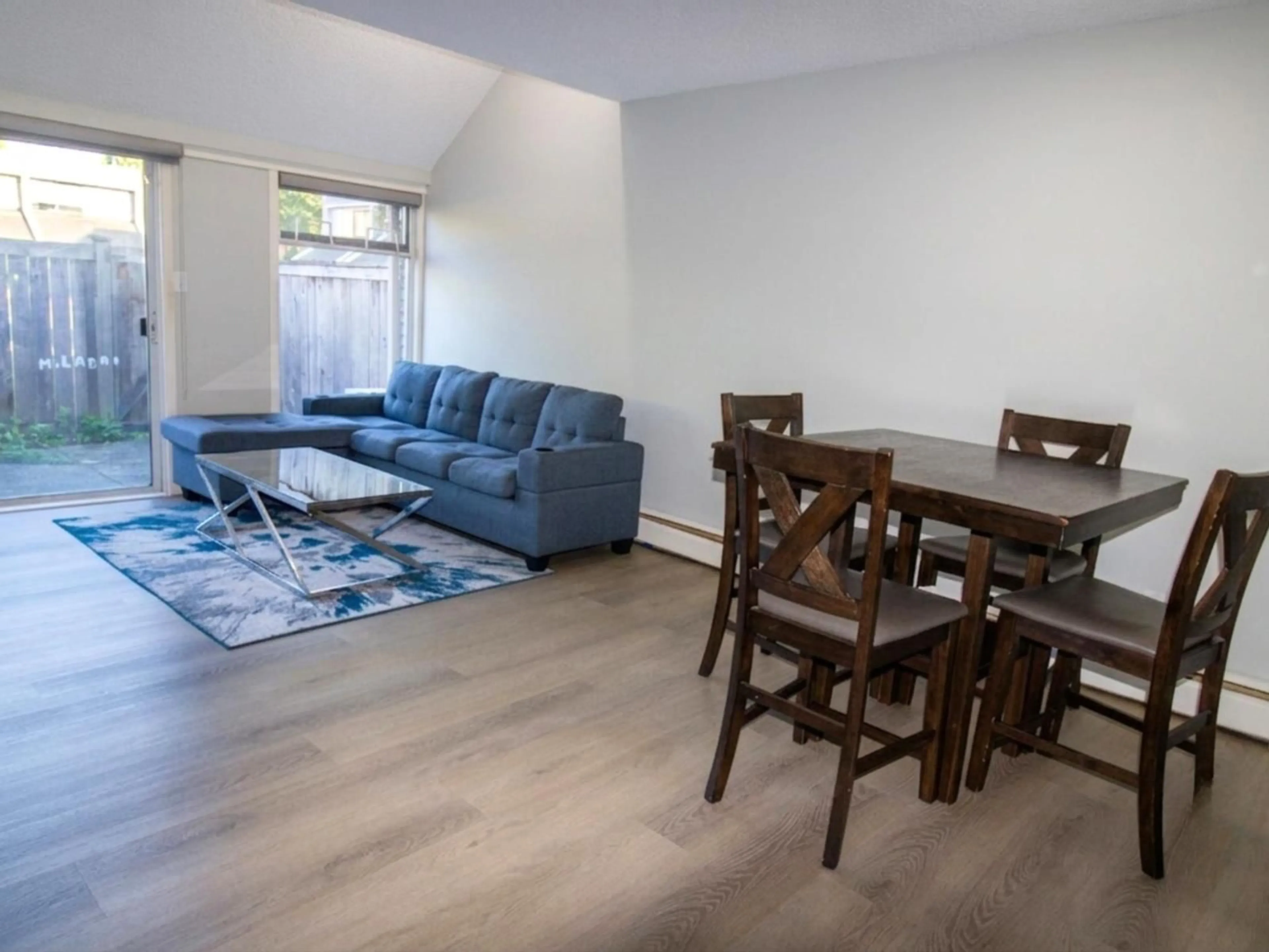 Living room with furniture, wood/laminate floor for 35 - 17706 60 AVENUE, Surrey British Columbia V3S1V2