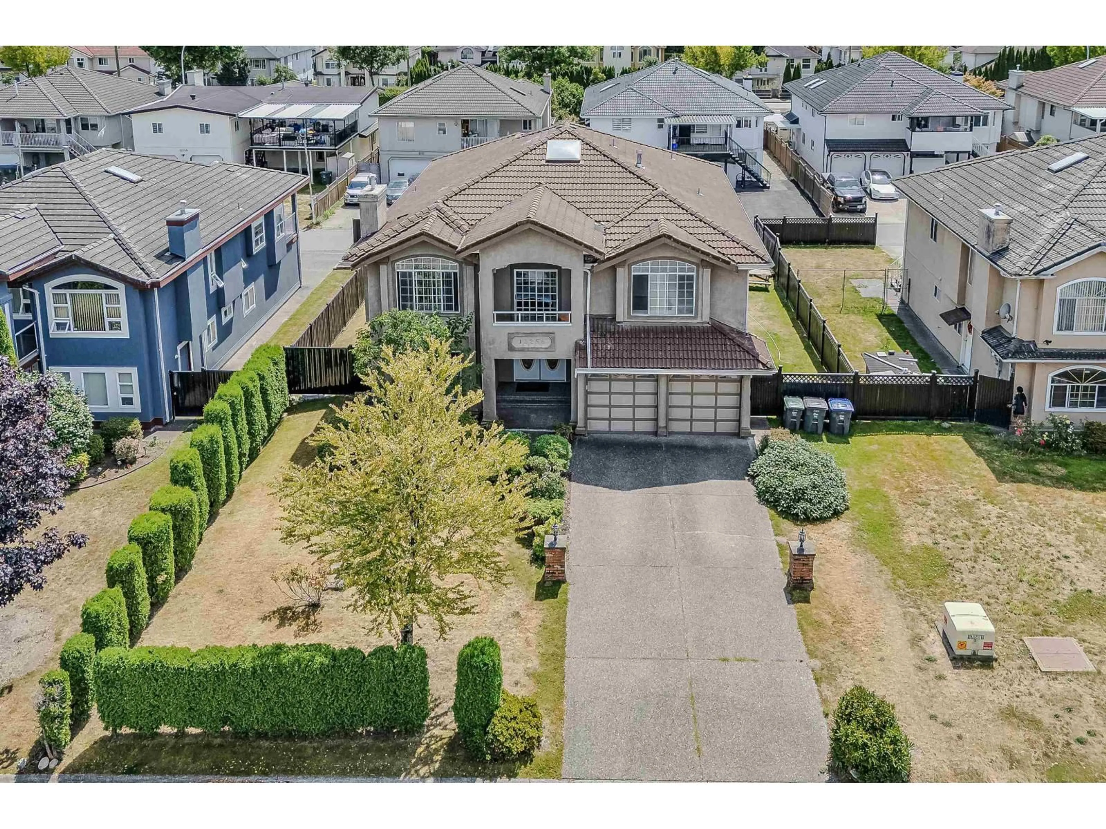 A pic from outside/outdoor area/front of a property/back of a property/a pic from drone, street for 12256 64A AVENUE, Surrey British Columbia V3W3R8