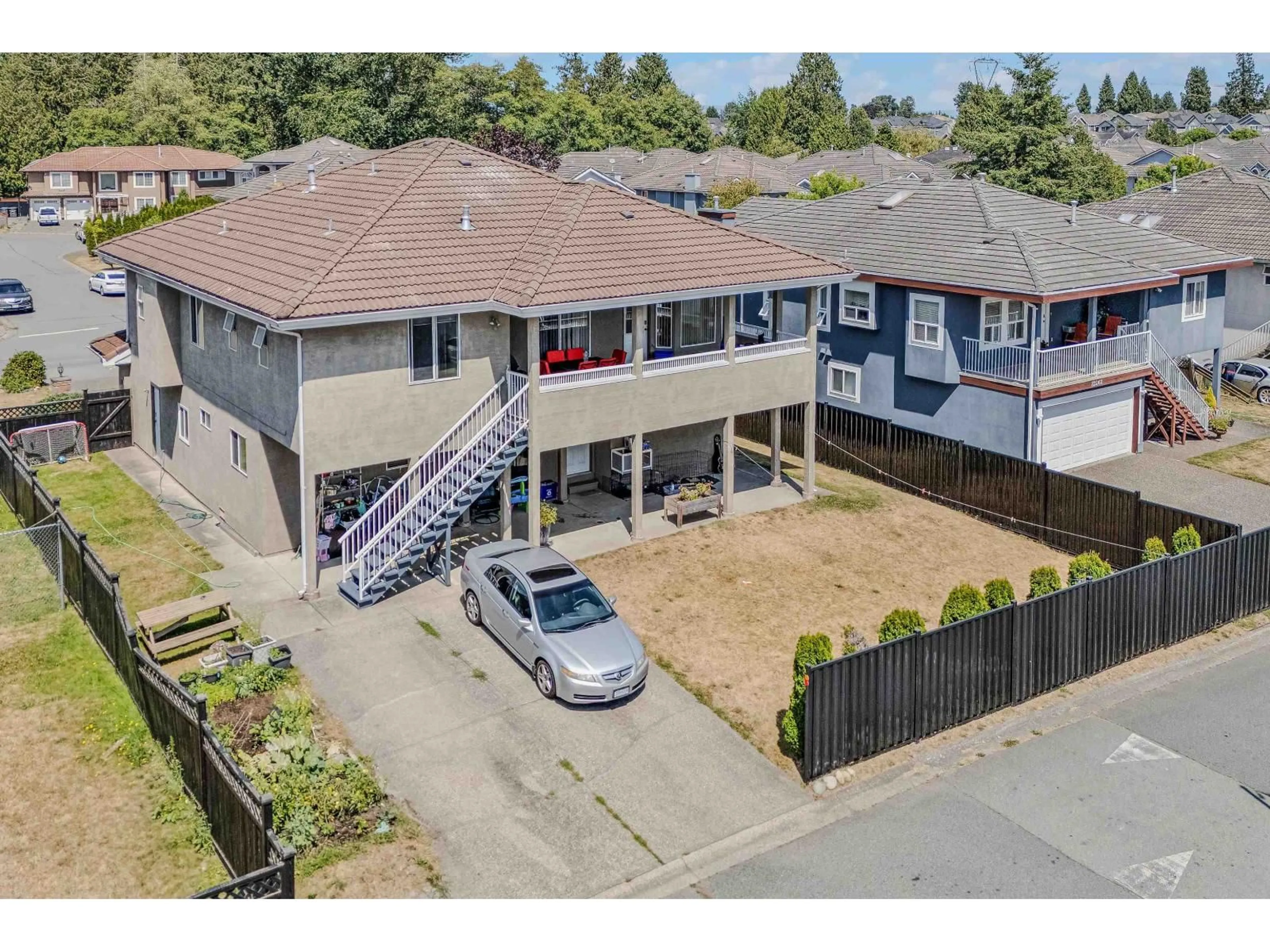 A pic from outside/outdoor area/front of a property/back of a property/a pic from drone, street for 12256 64A AVENUE, Surrey British Columbia V3W3R8