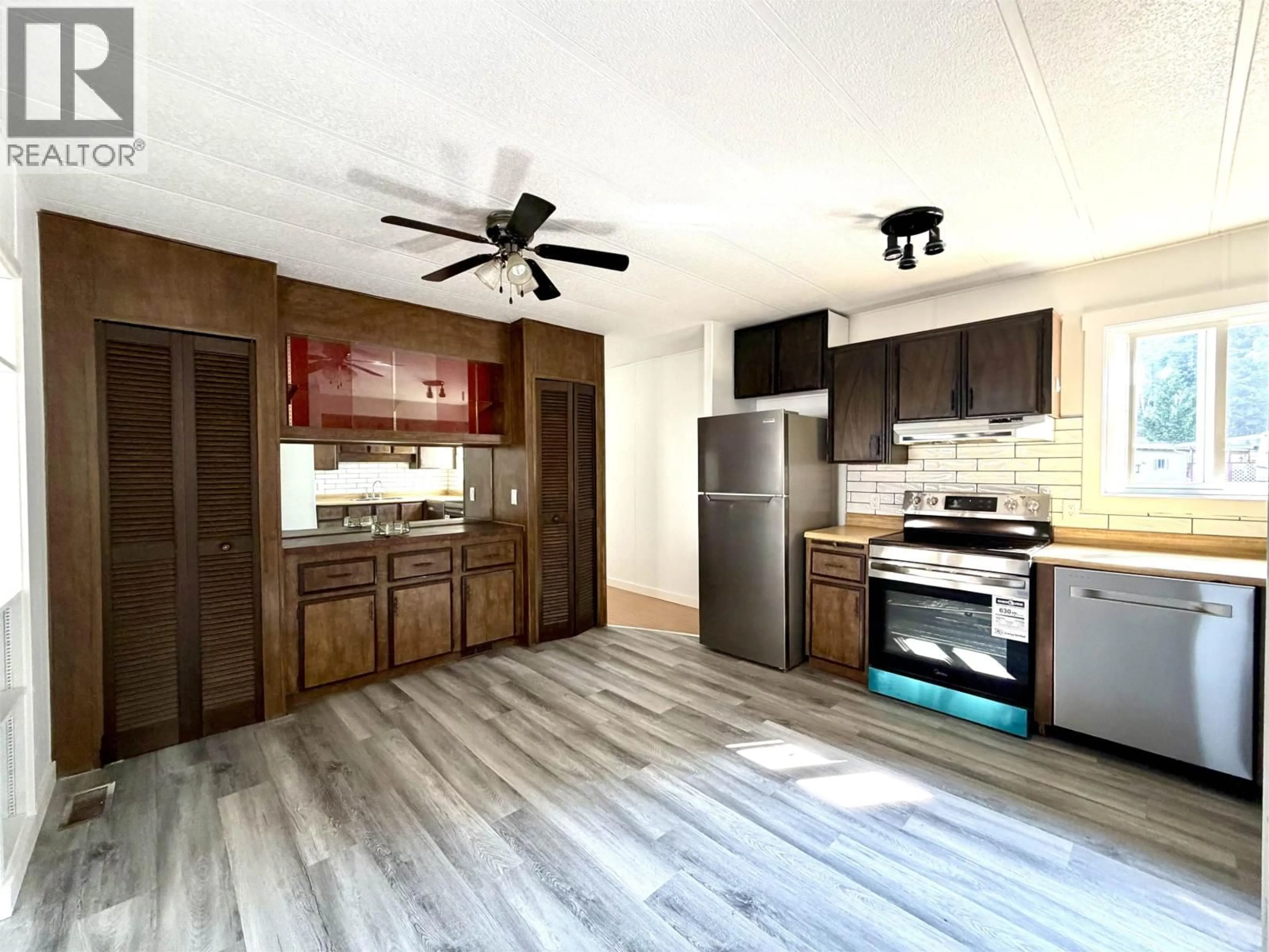 Open concept kitchen, wood/laminate floor for 9 - 4620 LOWRIE AVENUE, Terrace British Columbia V8G3X5