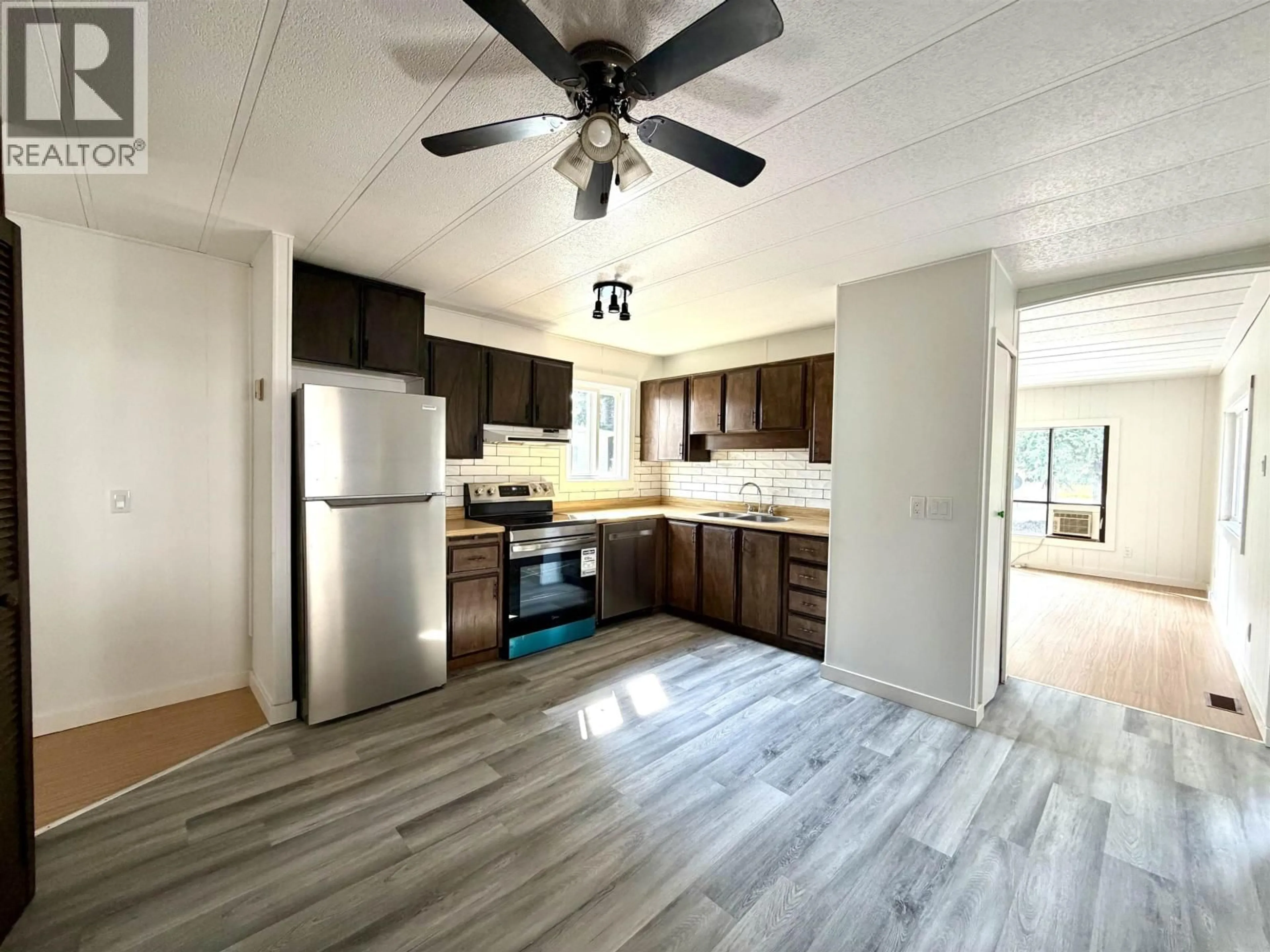 Open concept kitchen, wood/laminate floor for 9 - 4620 LOWRIE AVENUE, Terrace British Columbia V8G3X5