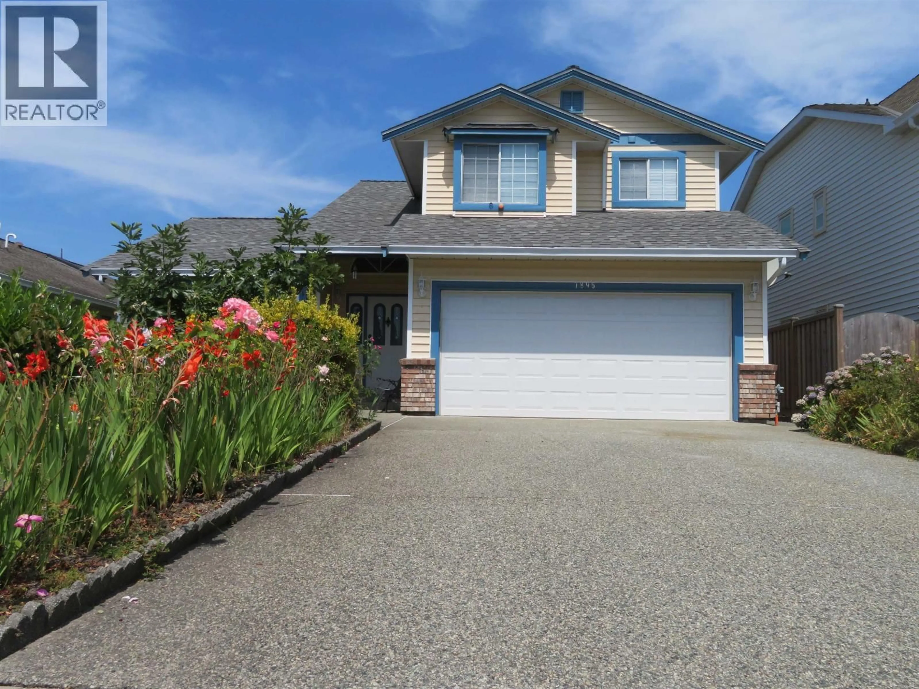 Home with vinyl exterior material, street for 1895 YUKON AVENUE, Port Coquitlam British Columbia V3C5B6