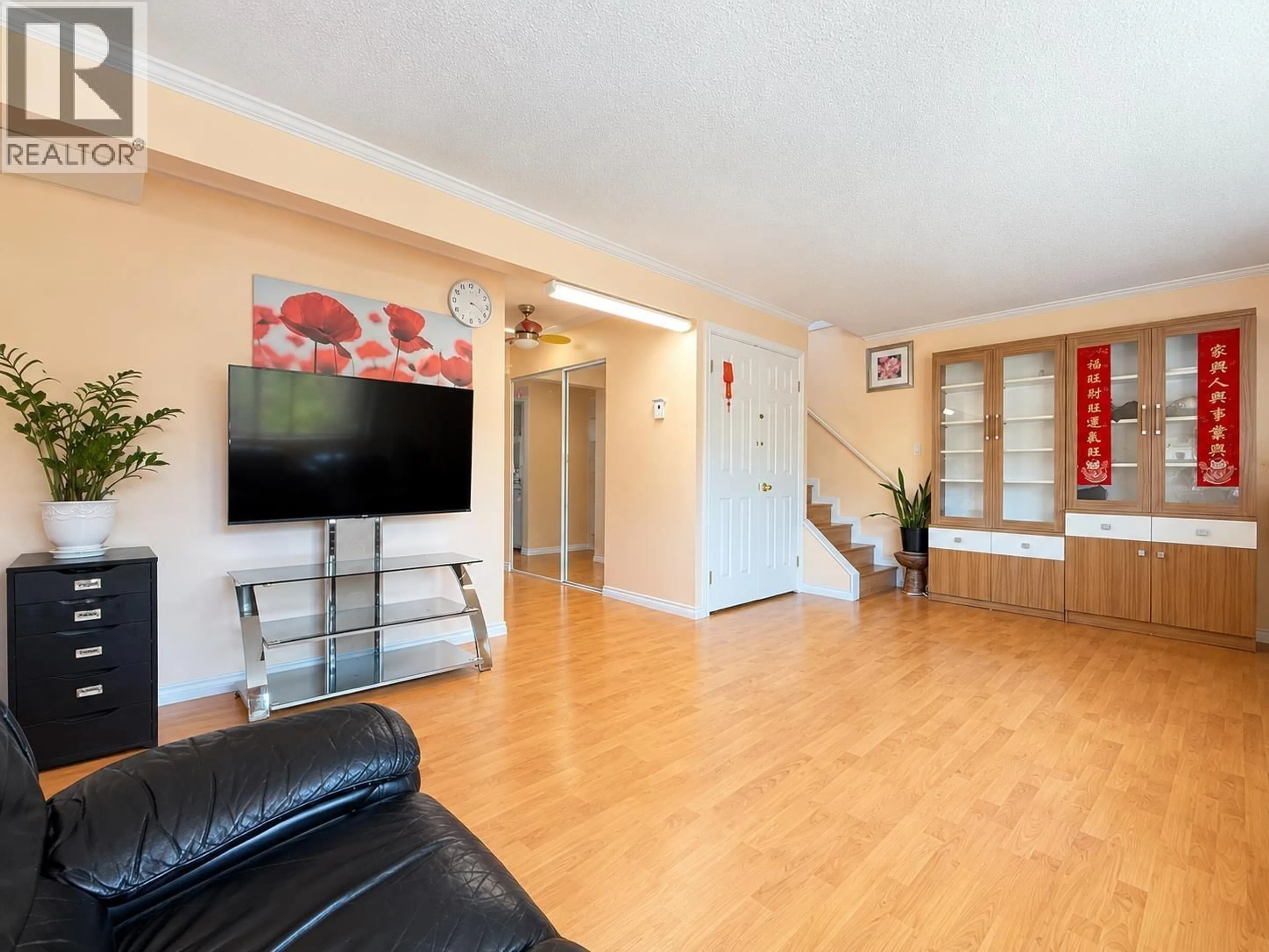 Living room with furniture, wood/laminate floor for 7031 LINDSAY ROAD, Richmond British Columbia V7C2P5
