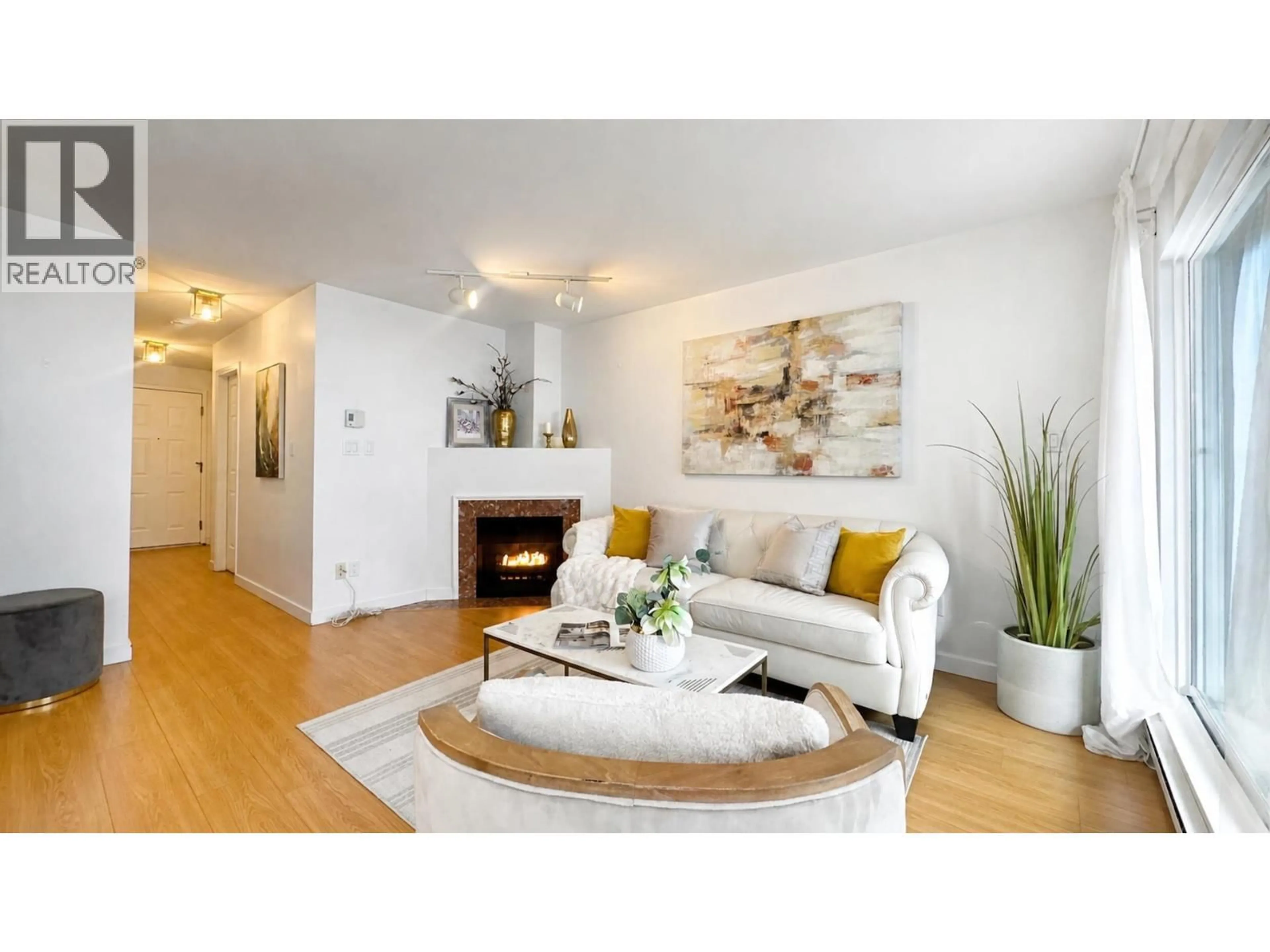 Living room with furniture, wood/laminate floor for 103 - 985 10TH AVENUE, Vancouver British Columbia V5Z1L9