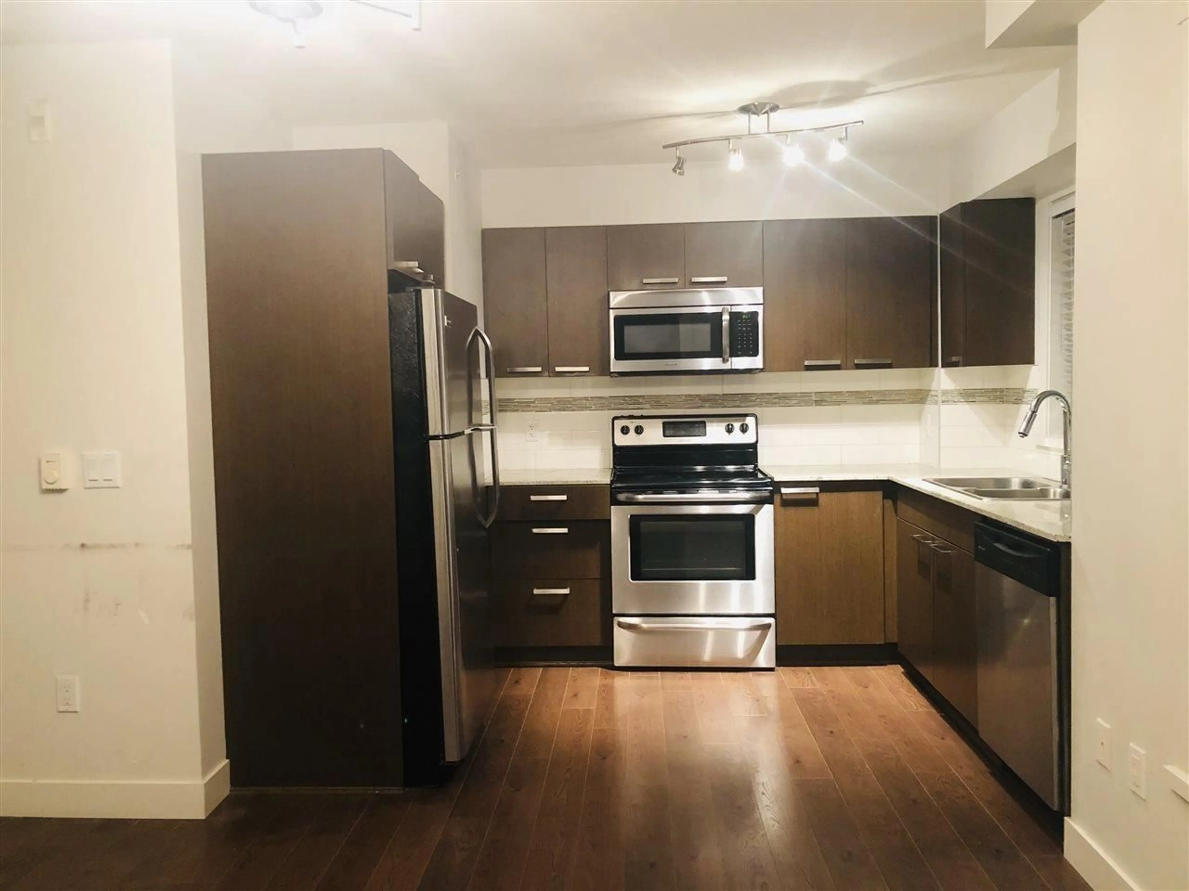 Standard kitchen, wood/laminate floor for 717 - 13883 LAUREL DRIVE, Surrey British Columbia V3T1A8