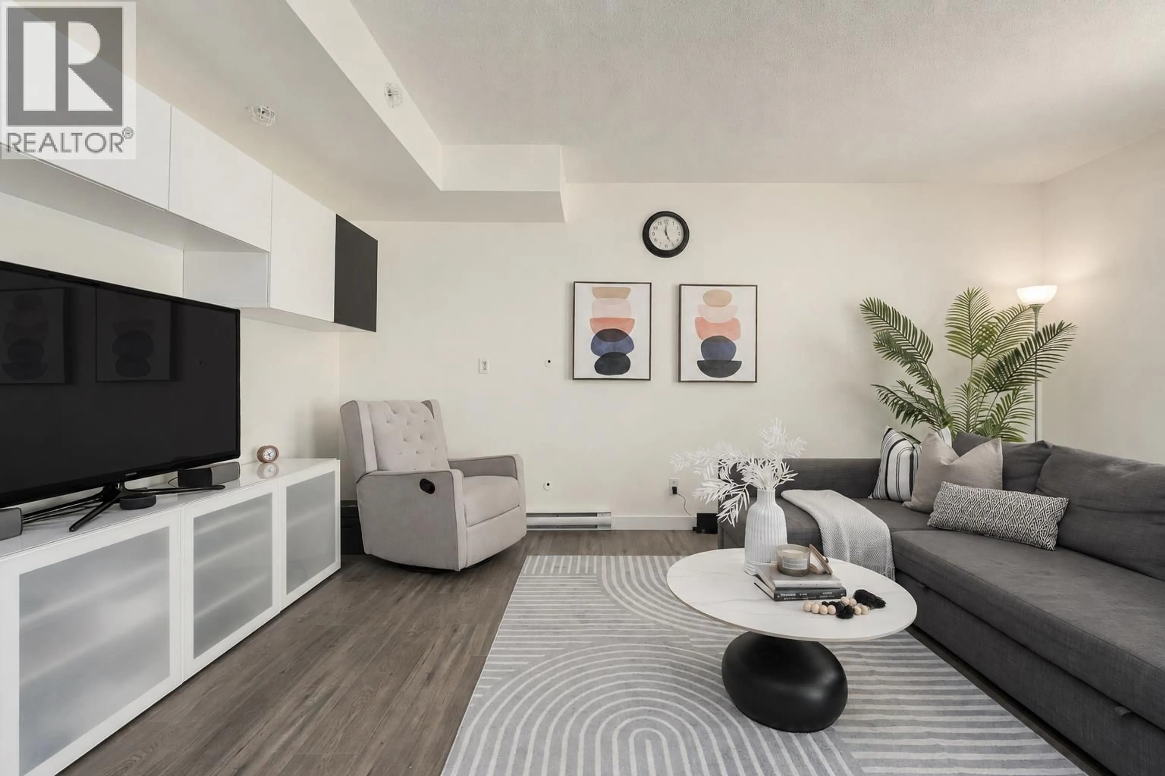 Living room with furniture, unknown for 103 - 2232 DOUGLAS ROAD, Burnaby British Columbia V5C0G9