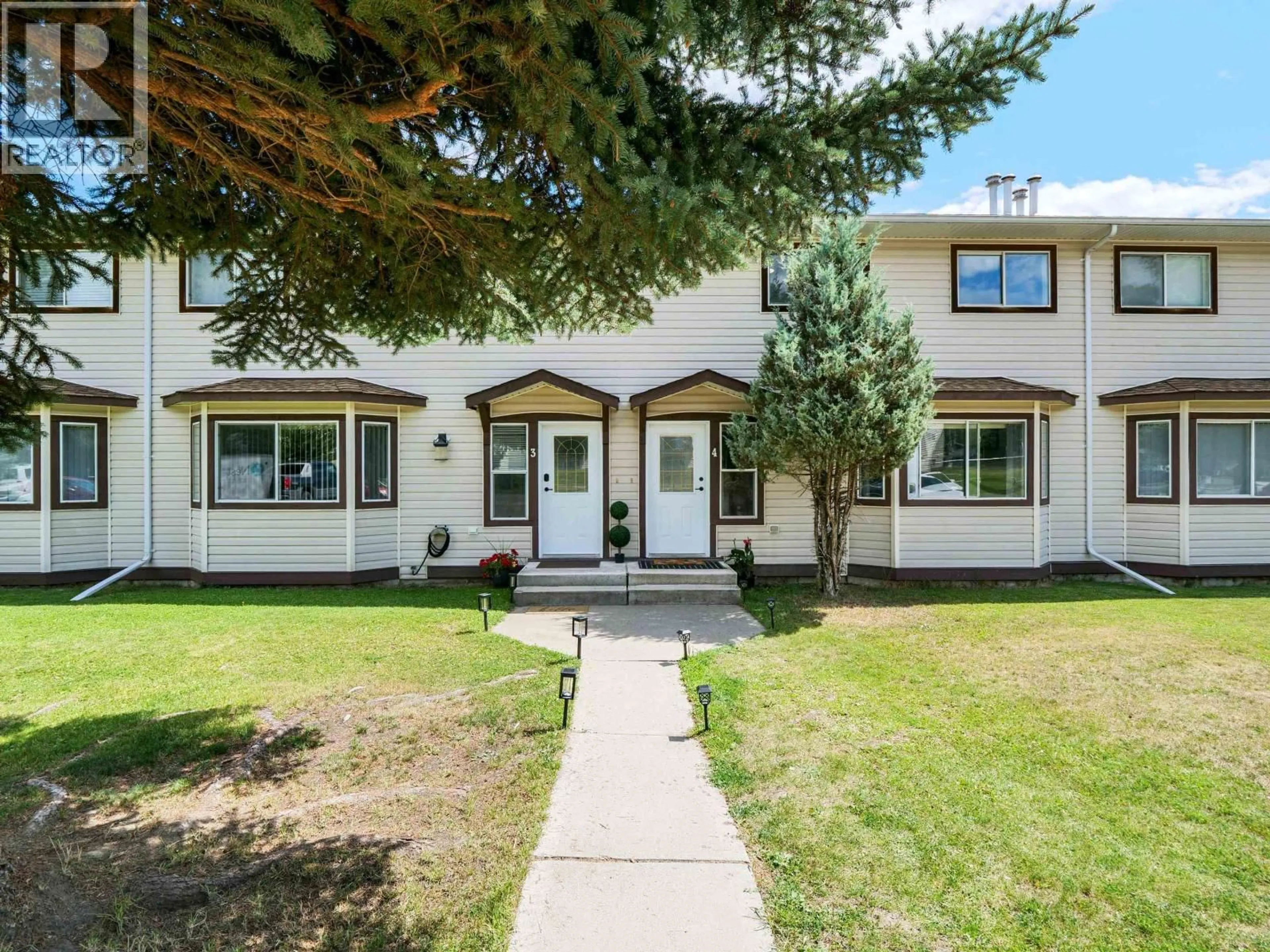 Home with vinyl exterior material, street for 4 - 410 PINCHBECK STREET, Quesnel British Columbia V2J6A3