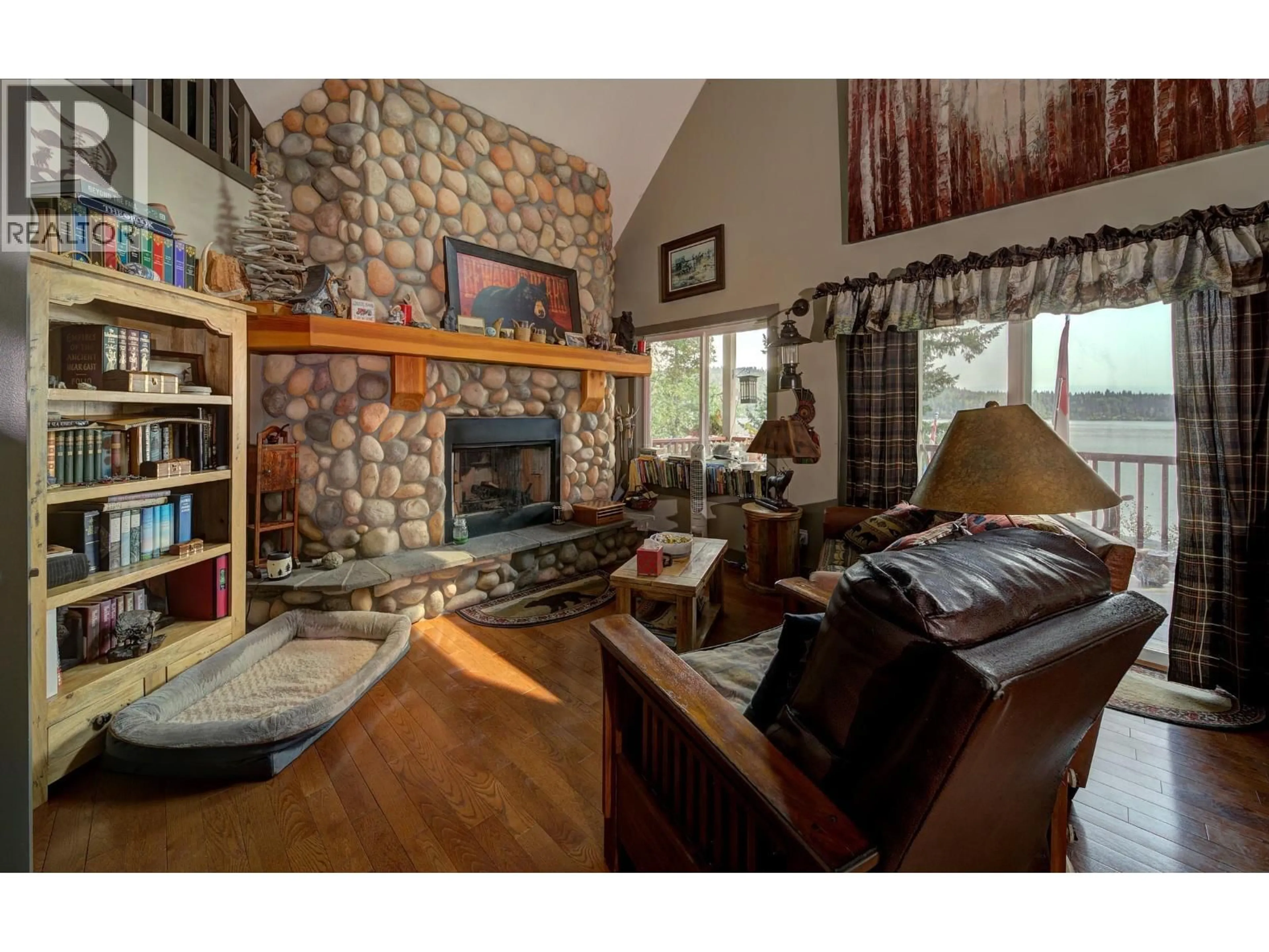 Living room with furniture, wood/laminate floor for 3548 HATCHERY ROAD, Horsefly British Columbia V0L1L0