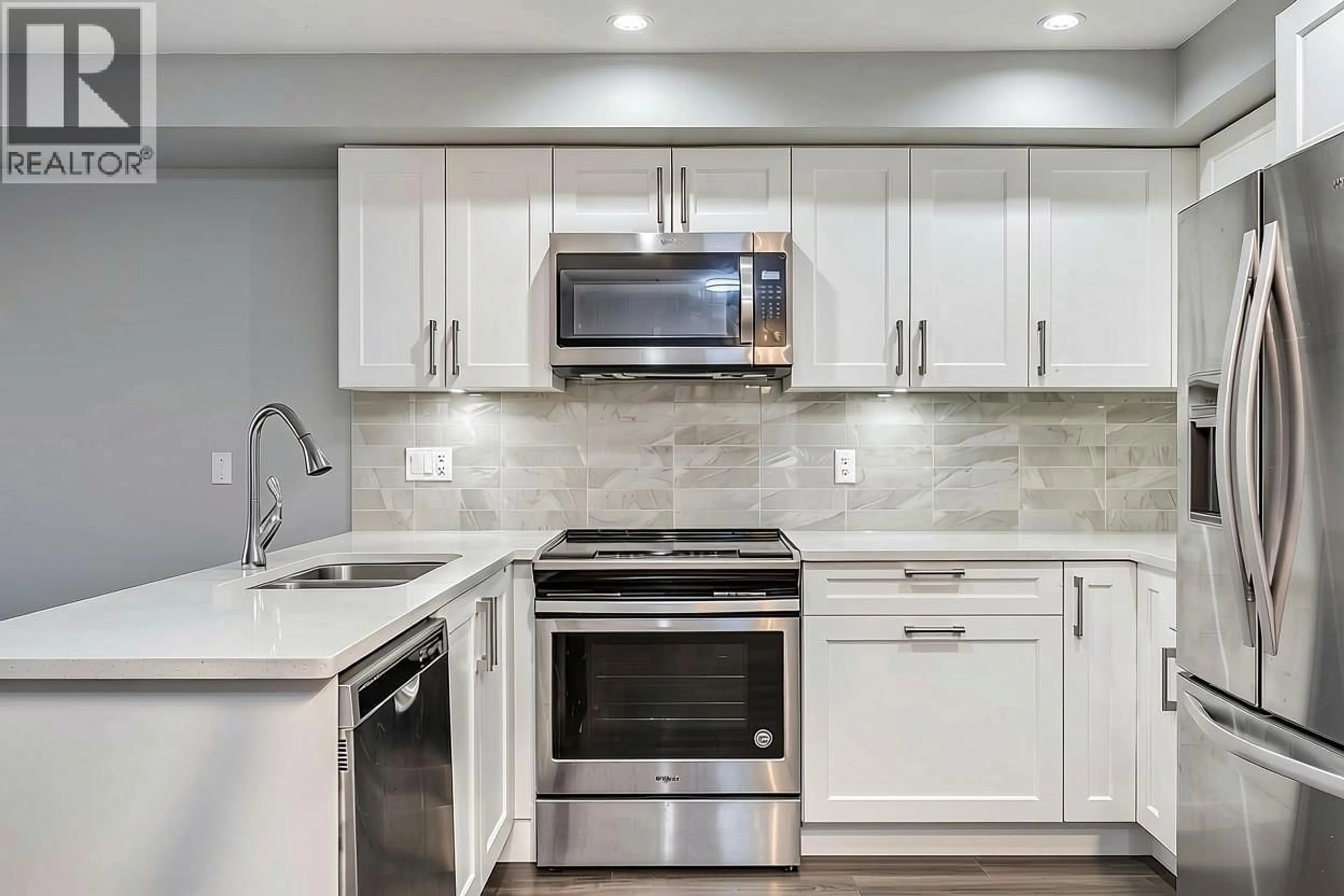 Open concept kitchen, ceramic/tile floor for 204 - 1990 WESTMINSTER AVENUE, Port Coquitlam British Columbia V3B1E8