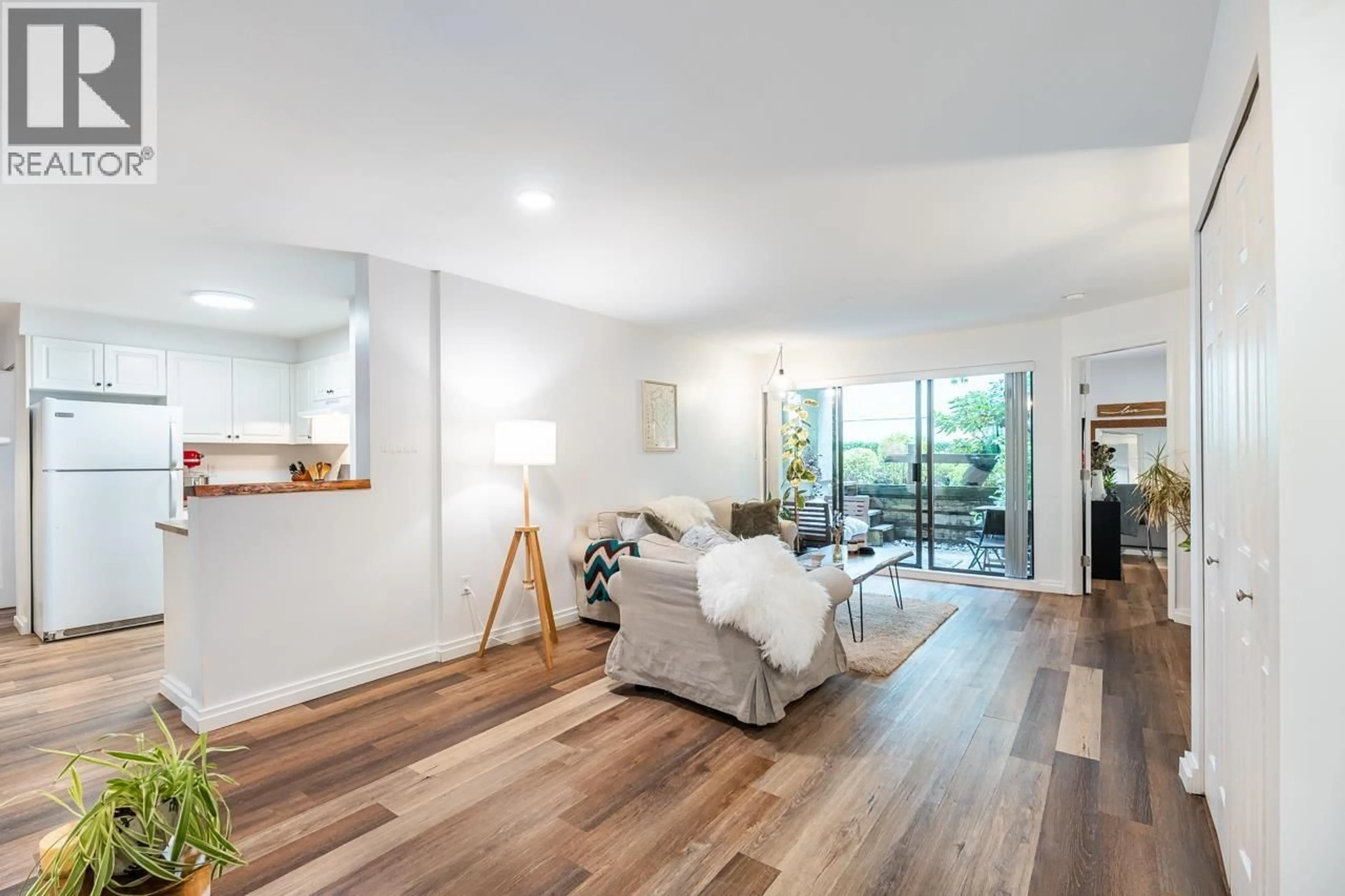 Living room with furniture, wood/laminate floor for 108 - 1200 PACIFIC STREET, Coquitlam British Columbia V3B6K2