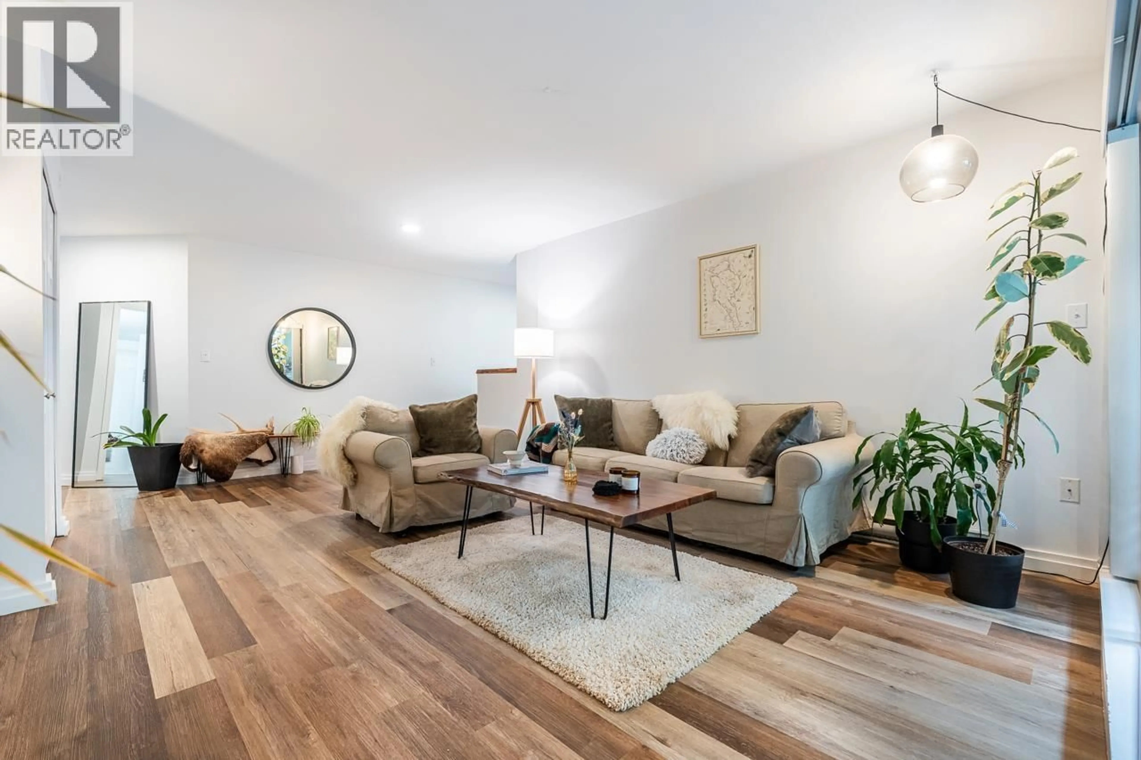 Living room with furniture, wood/laminate floor for 108 - 1200 PACIFIC STREET, Coquitlam British Columbia V3B6K2