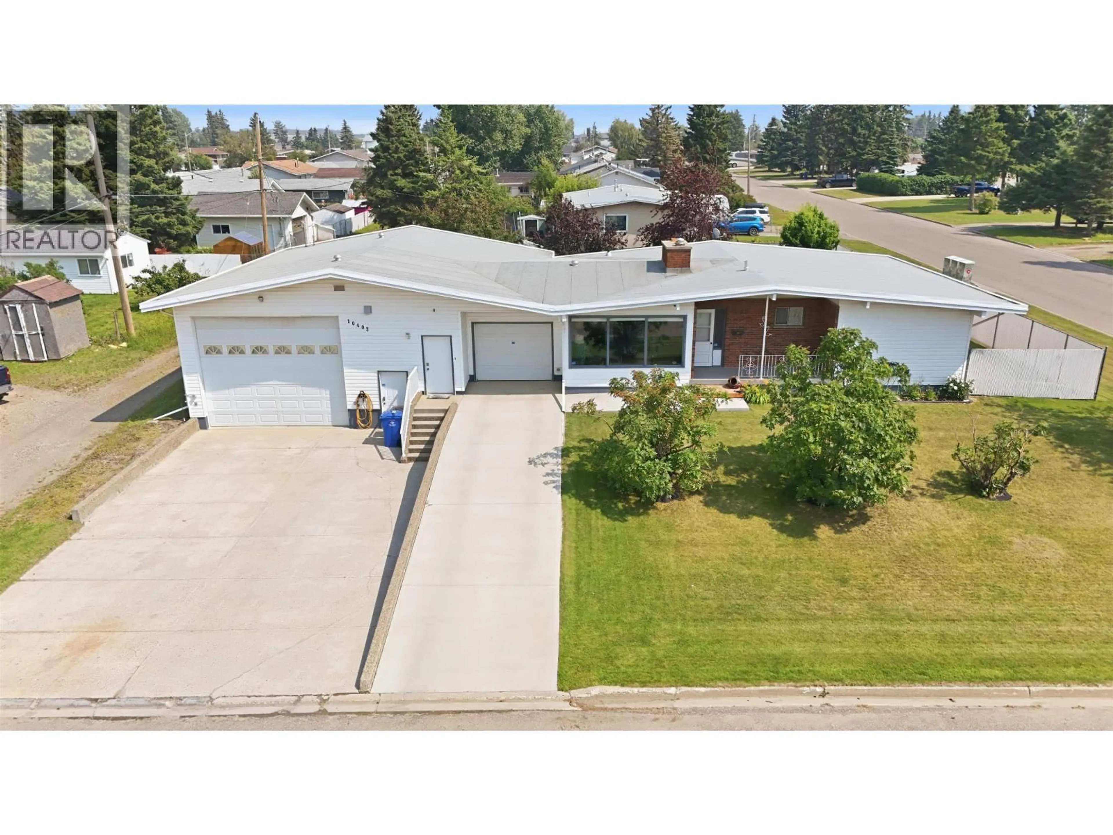 A pic from outside/outdoor area/front of a property/back of a property/a pic from drone, street for 10403 94 STREET, Fort St. John British Columbia V1J3L7