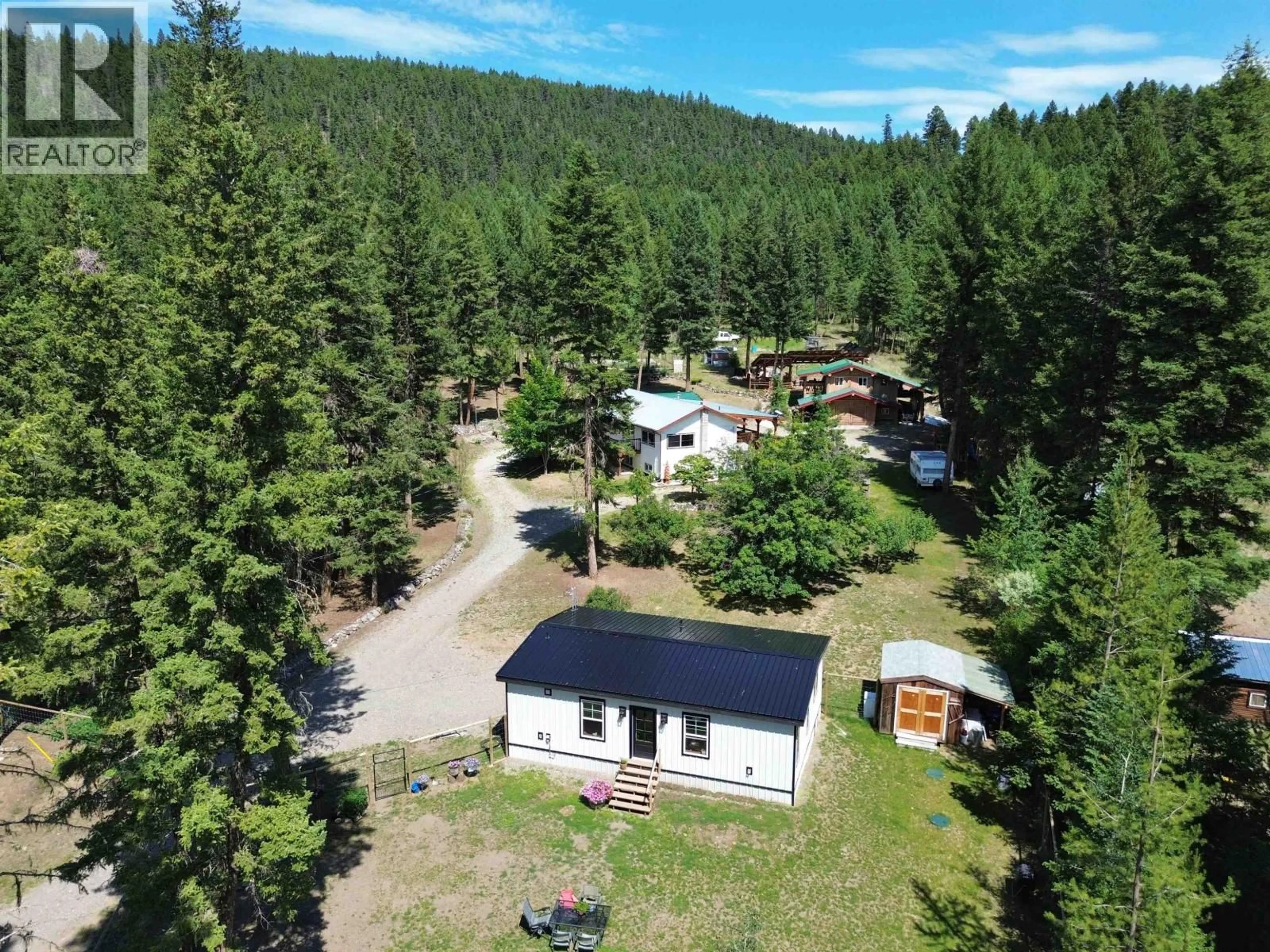 A pic from outside/outdoor area/front of a property/back of a property/a pic from drone, forest/trees view for 2435 SANDBERG ROAD, Williams Lake British Columbia V2G4W5