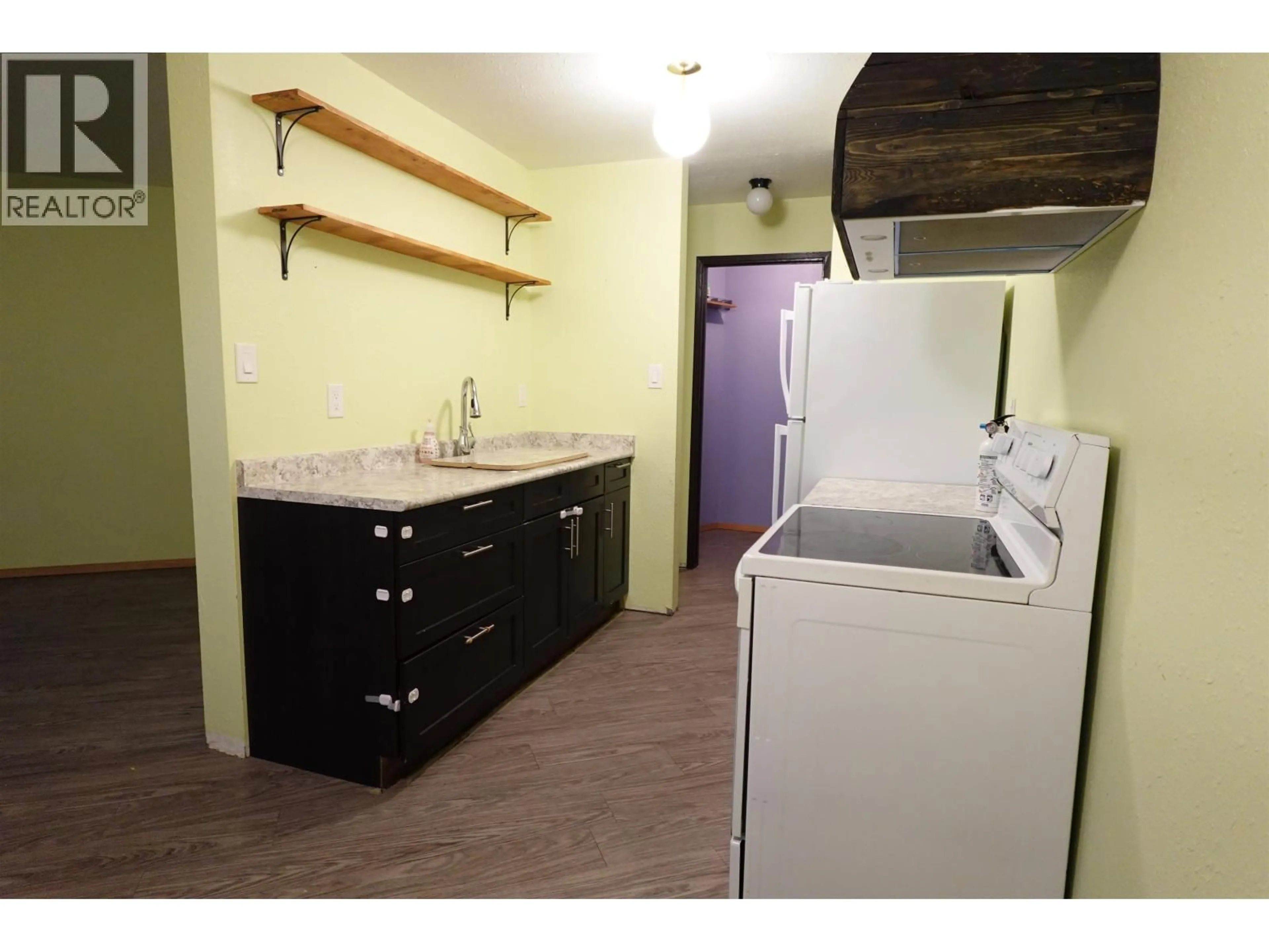 Standard kitchen, wood/laminate floor for 105 - 398 RODDIS DRIVE, Quesnel British Columbia V2J1A6