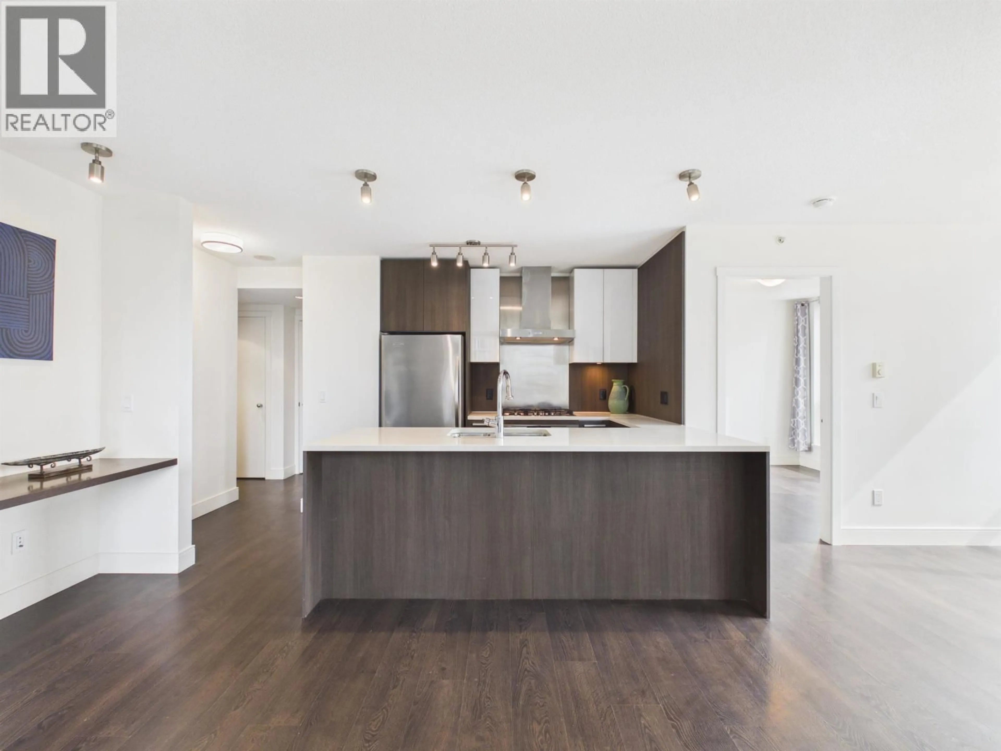 Open concept kitchen, wood/laminate floor for 805 - 3007 GLEN DRIVE, Coquitlam British Columbia V3B0L8