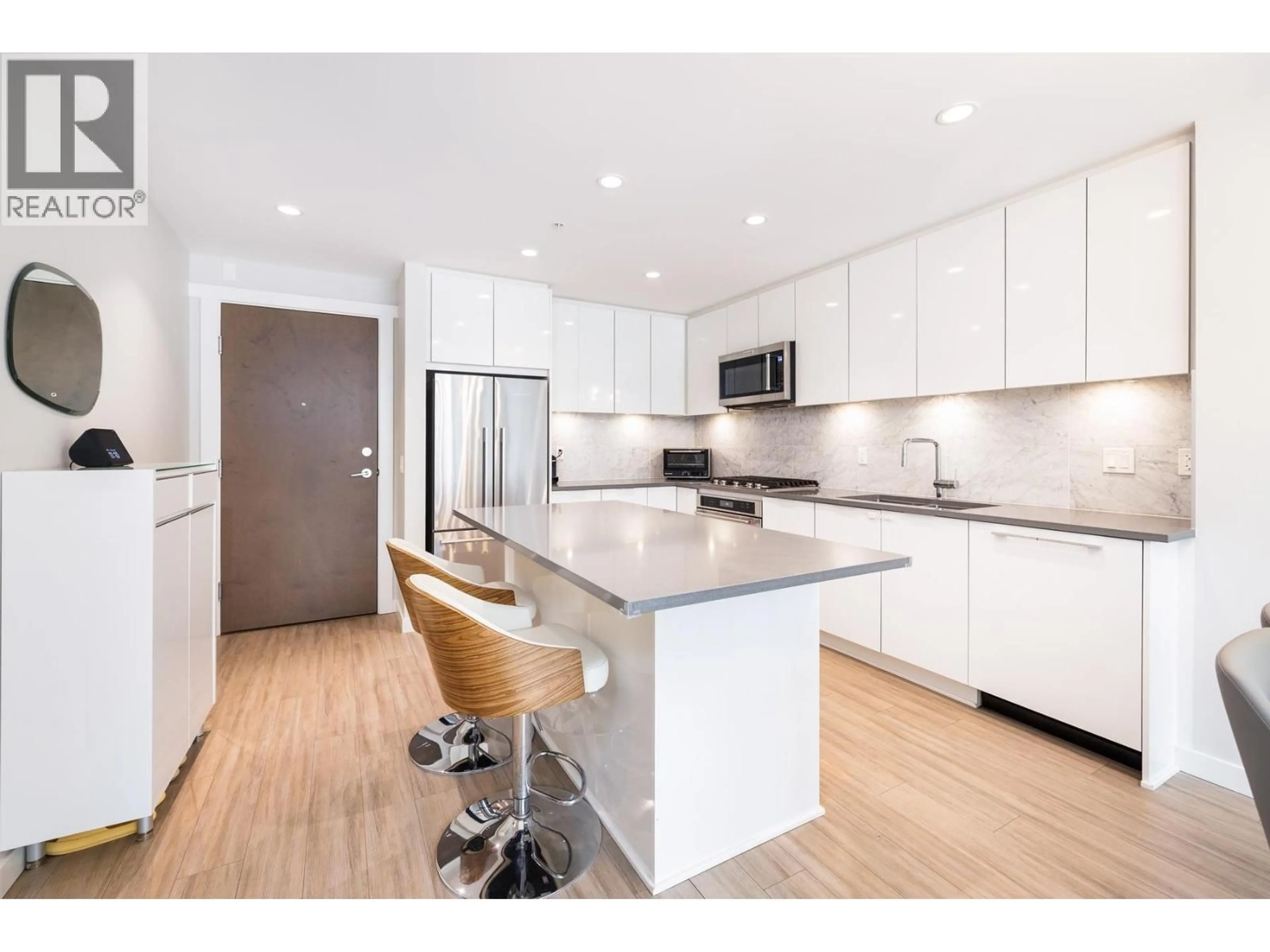 Open concept kitchen, wood/laminate floor for 302 - 2651 LIBRARY LANE, North Vancouver British Columbia V7J0C1