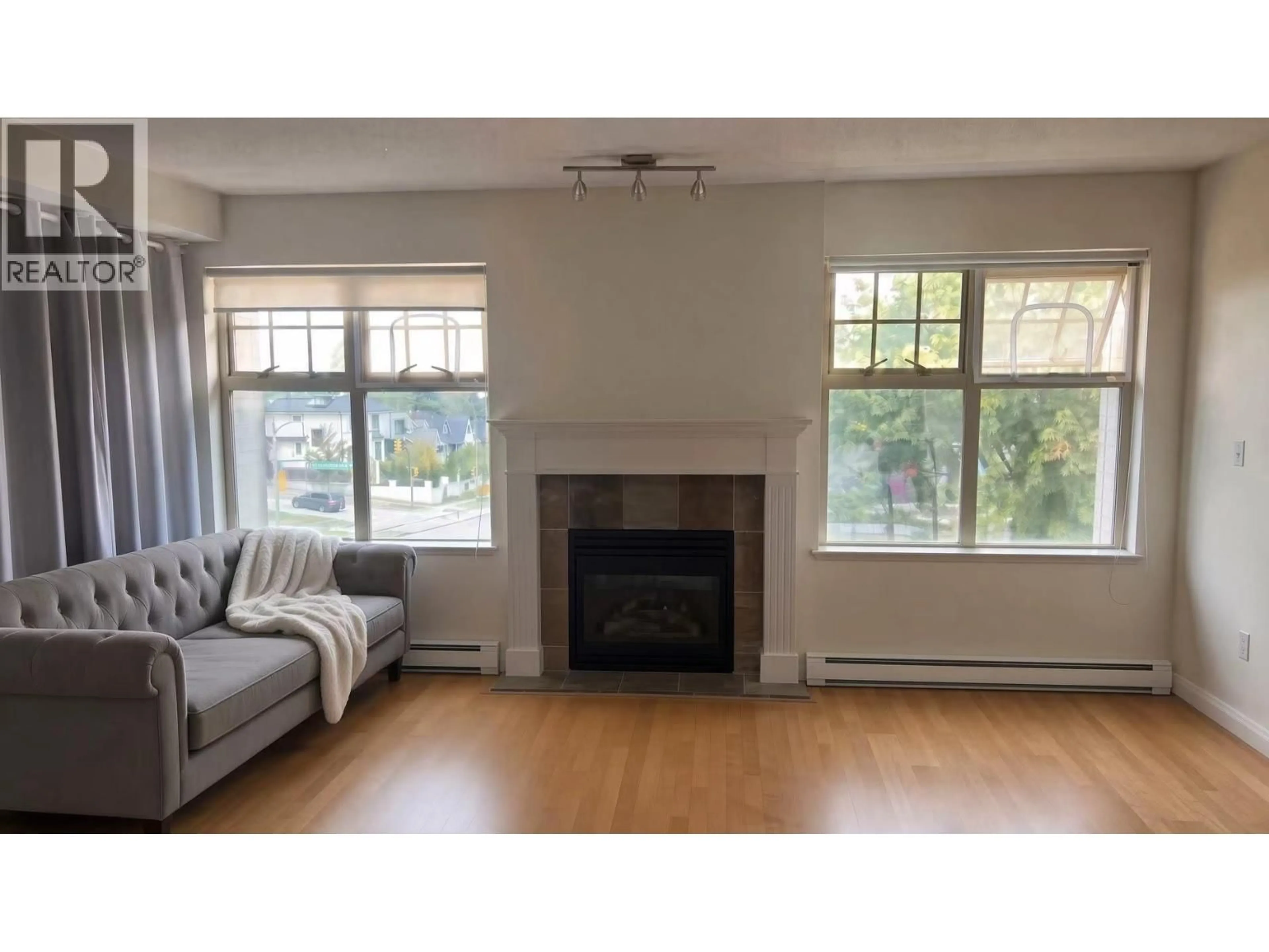 Living room with furniture, wood/laminate floor for 305 - 3595 26TH AVENUE, Vancouver British Columbia V6S1N8