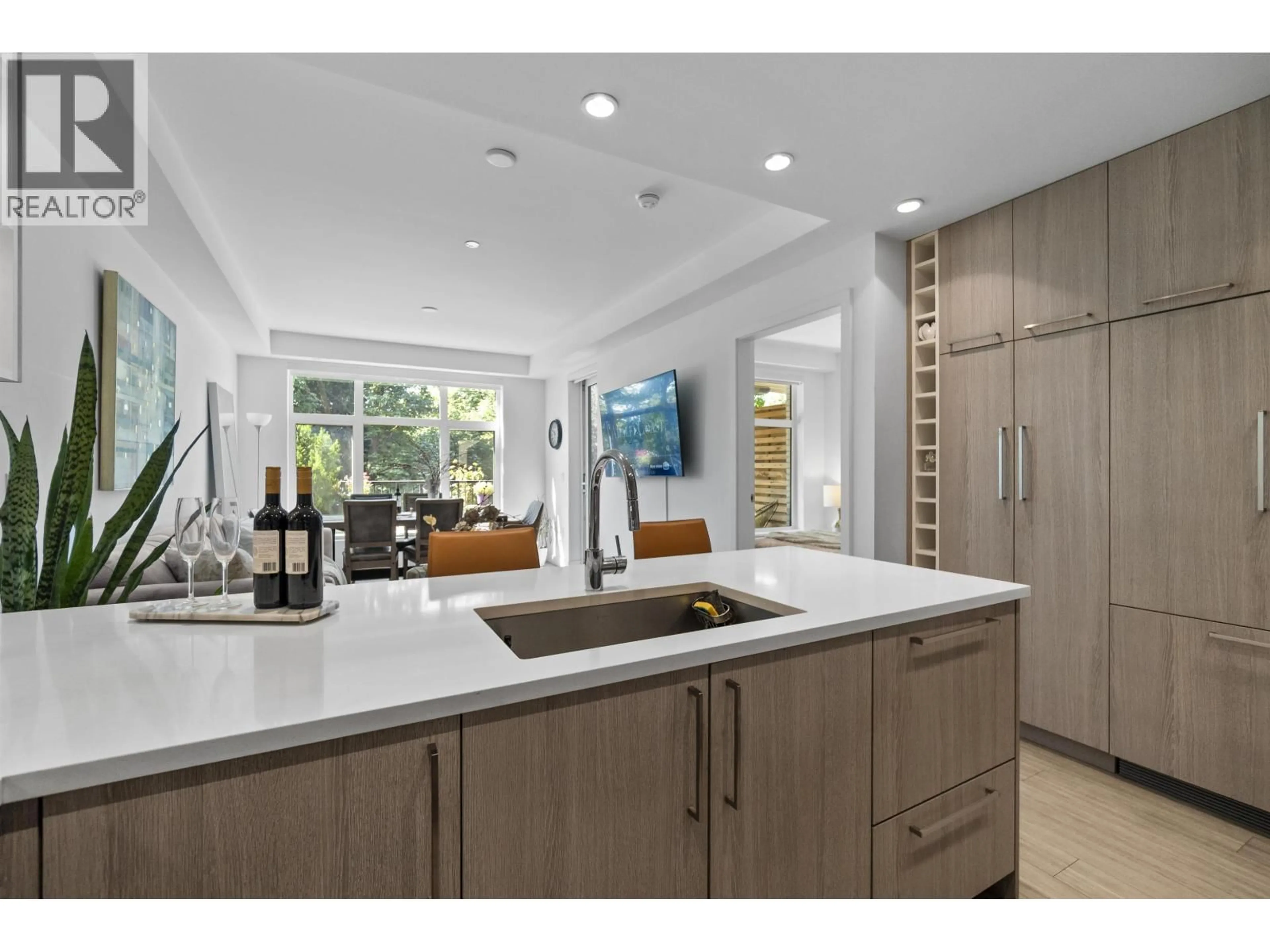 Open concept kitchen, ceramic/tile floor for 113 - 747 3RD STREET, North Vancouver British Columbia V7L1G8