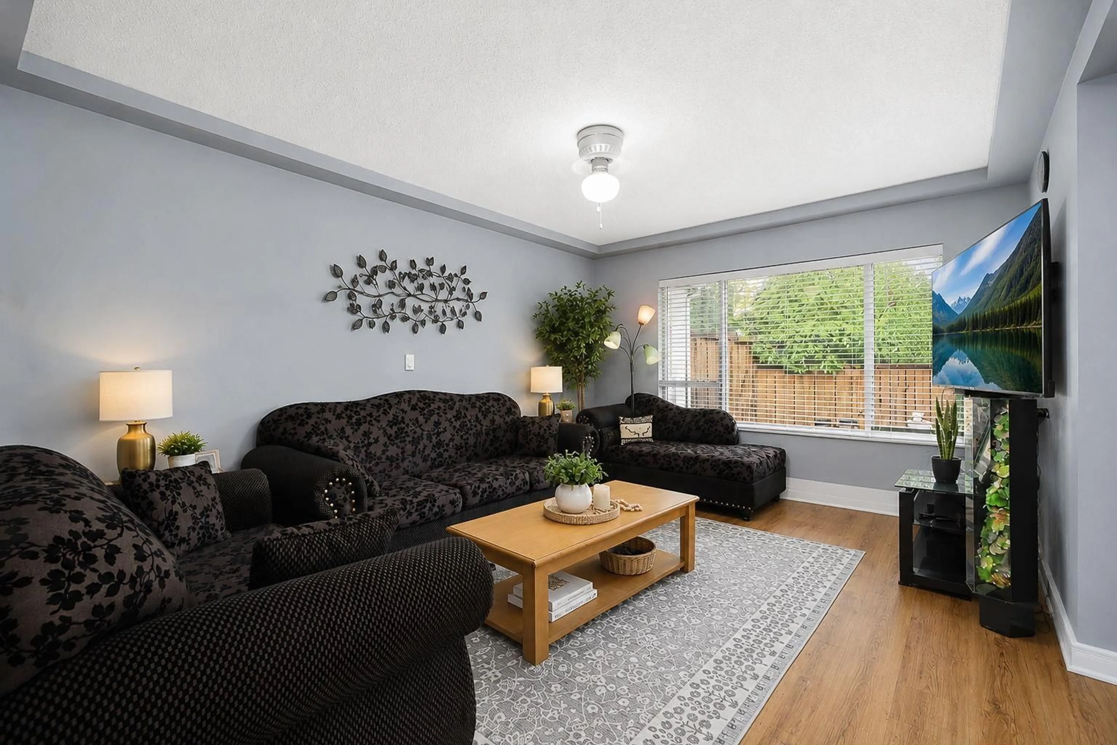Living room with furniture, wood/laminate floor for 20 - 3075 TRETHEWEY STREET, Abbotsford British Columbia V2T3R4