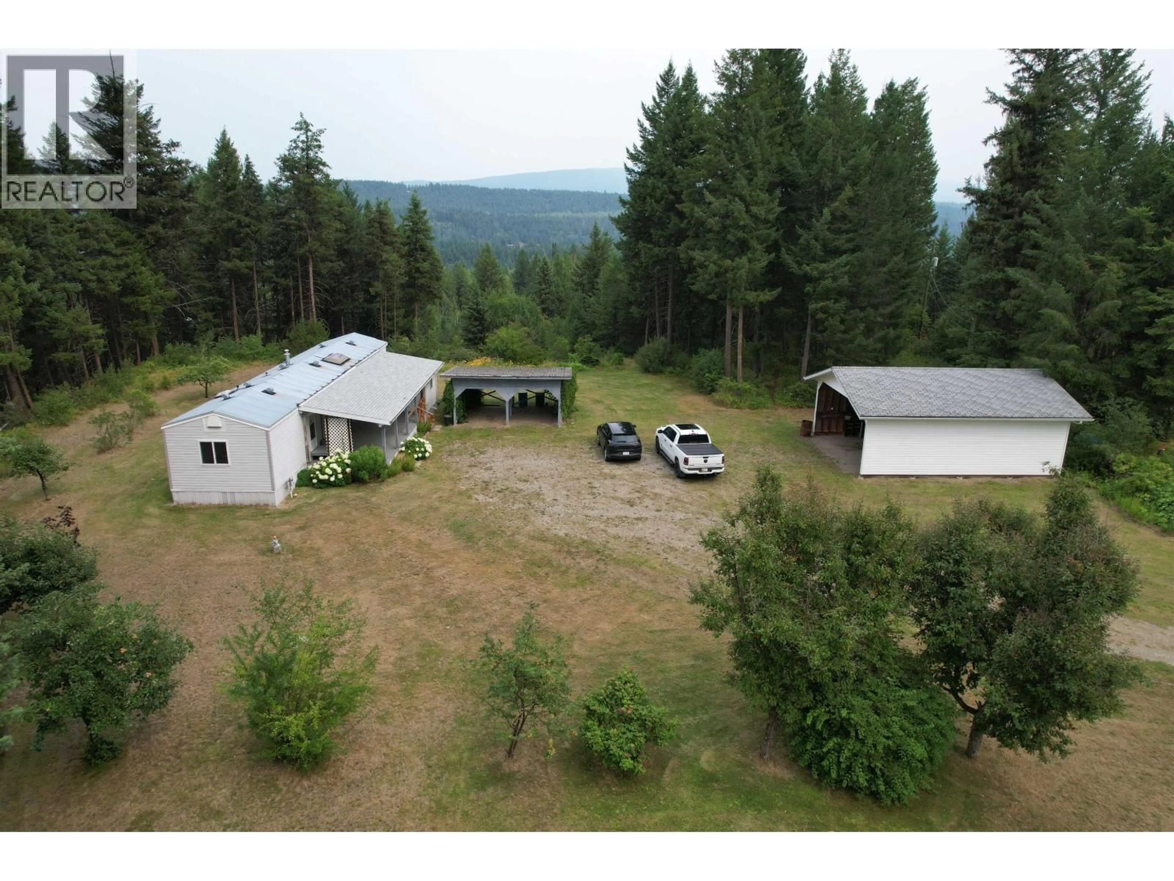 A pic from outside/outdoor area/front of a property/back of a property/a pic from drone, mountain view for 1931 ALMA ROAD, Quesnel British Columbia V2J6J3