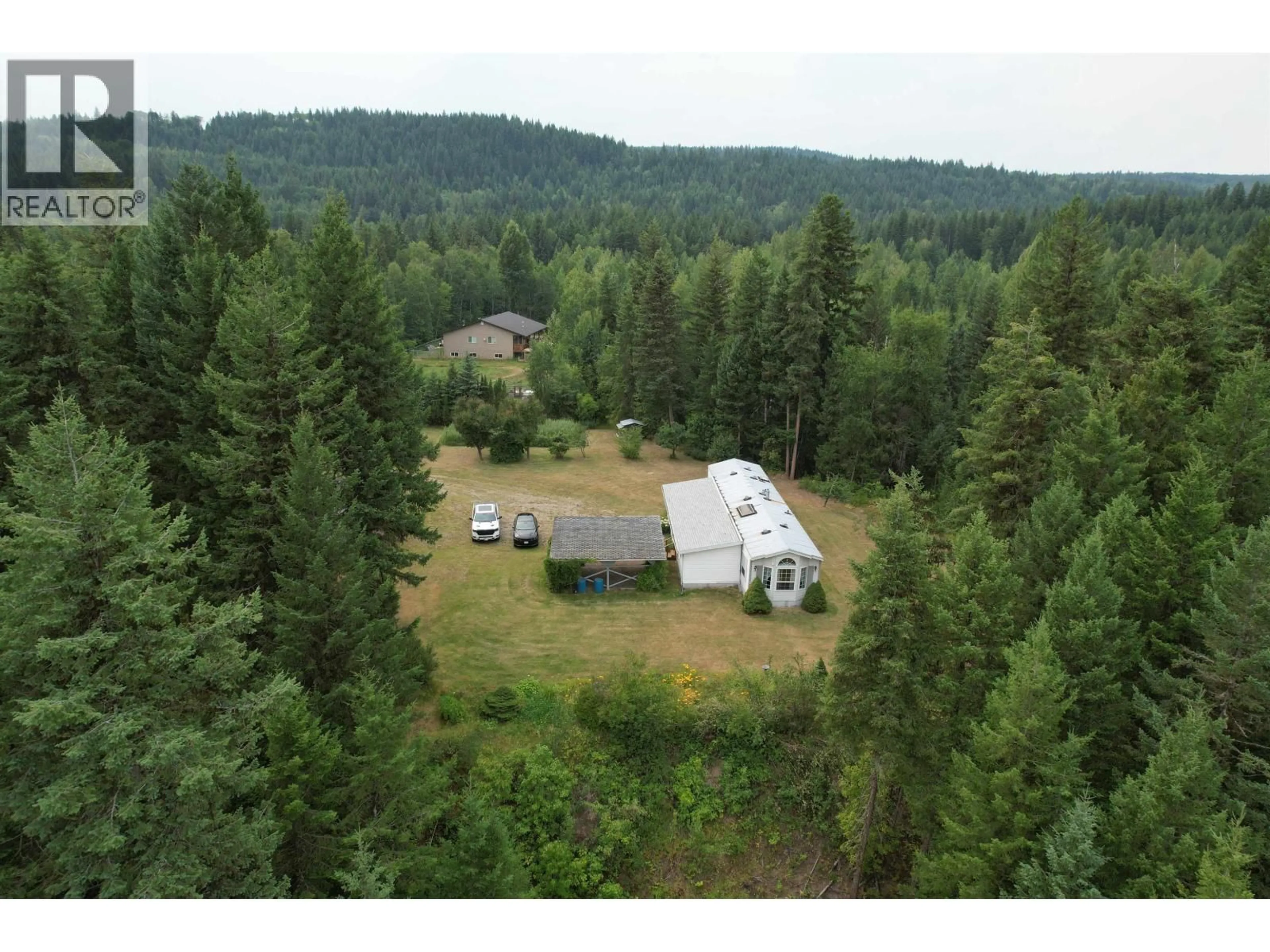 A pic from outside/outdoor area/front of a property/back of a property/a pic from drone, forest/trees view for 1931 ALMA ROAD, Quesnel British Columbia V2J6J3