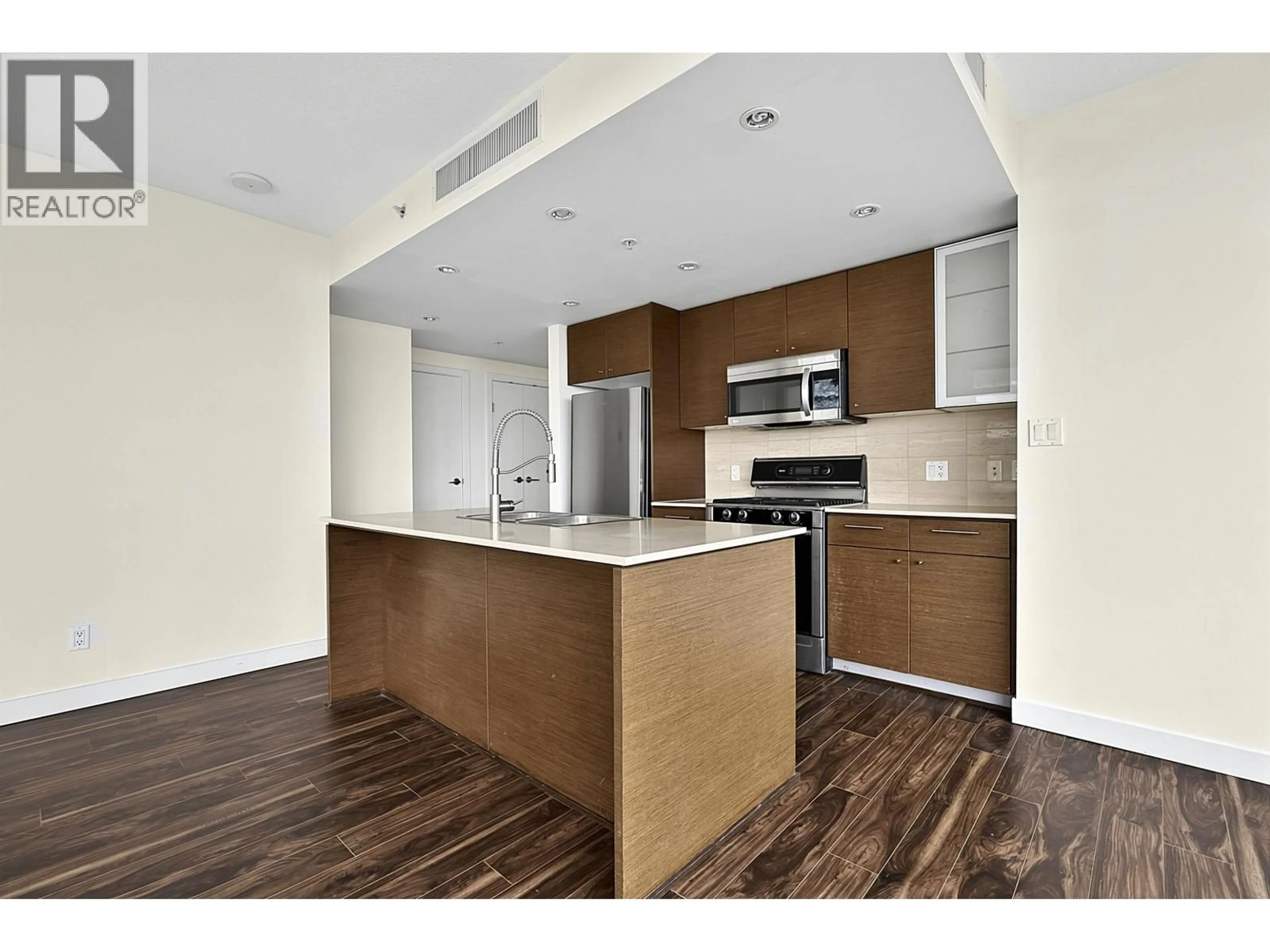 Open concept kitchen, wood/laminate floor for 1508 - 5900 ALDERBRIDGE WAY, Richmond British Columbia V6X0B6