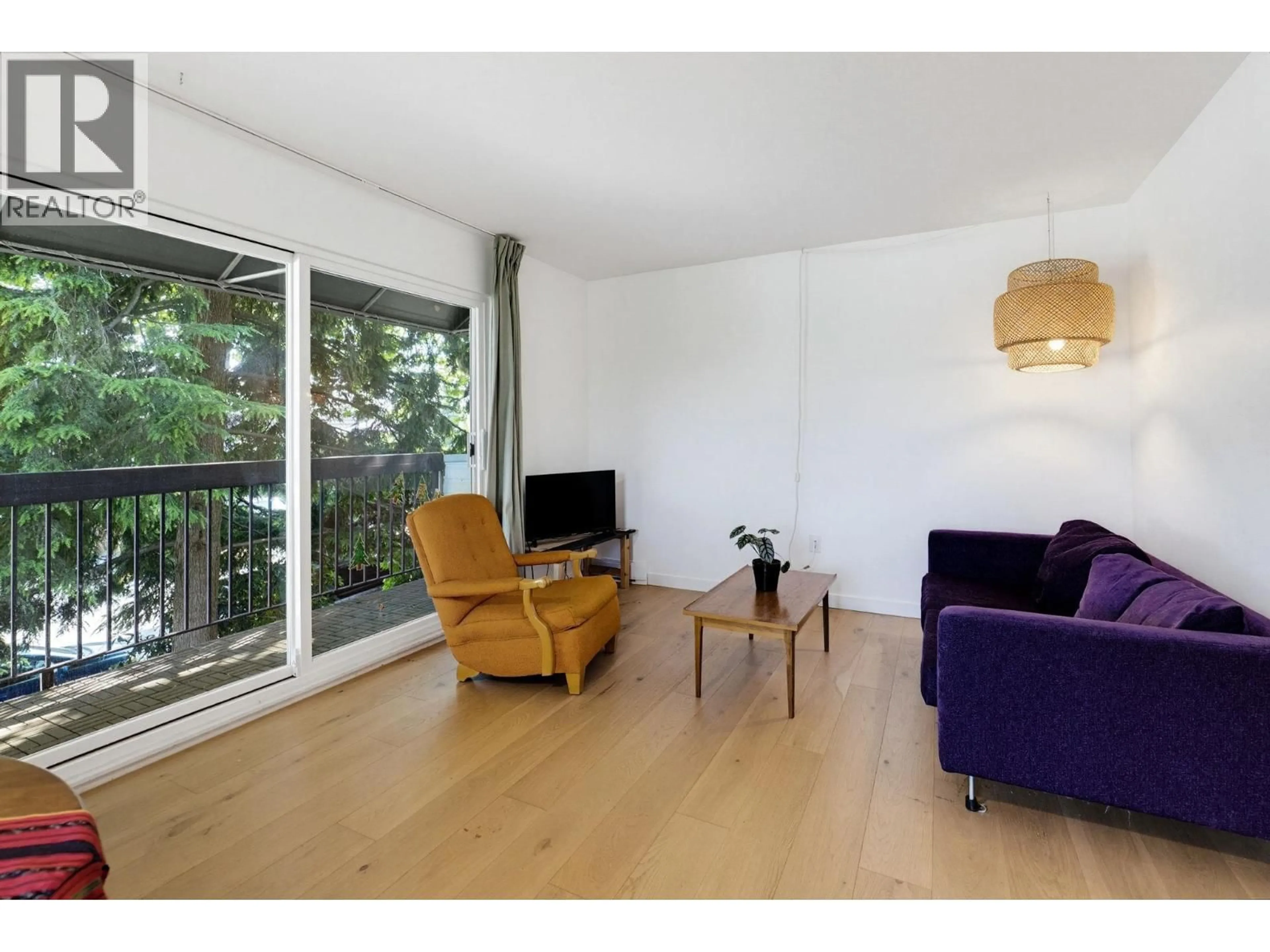 Living room with furniture, wood/laminate floor for 219 - 2910 PENDER STREET, Vancouver British Columbia V5K2C3