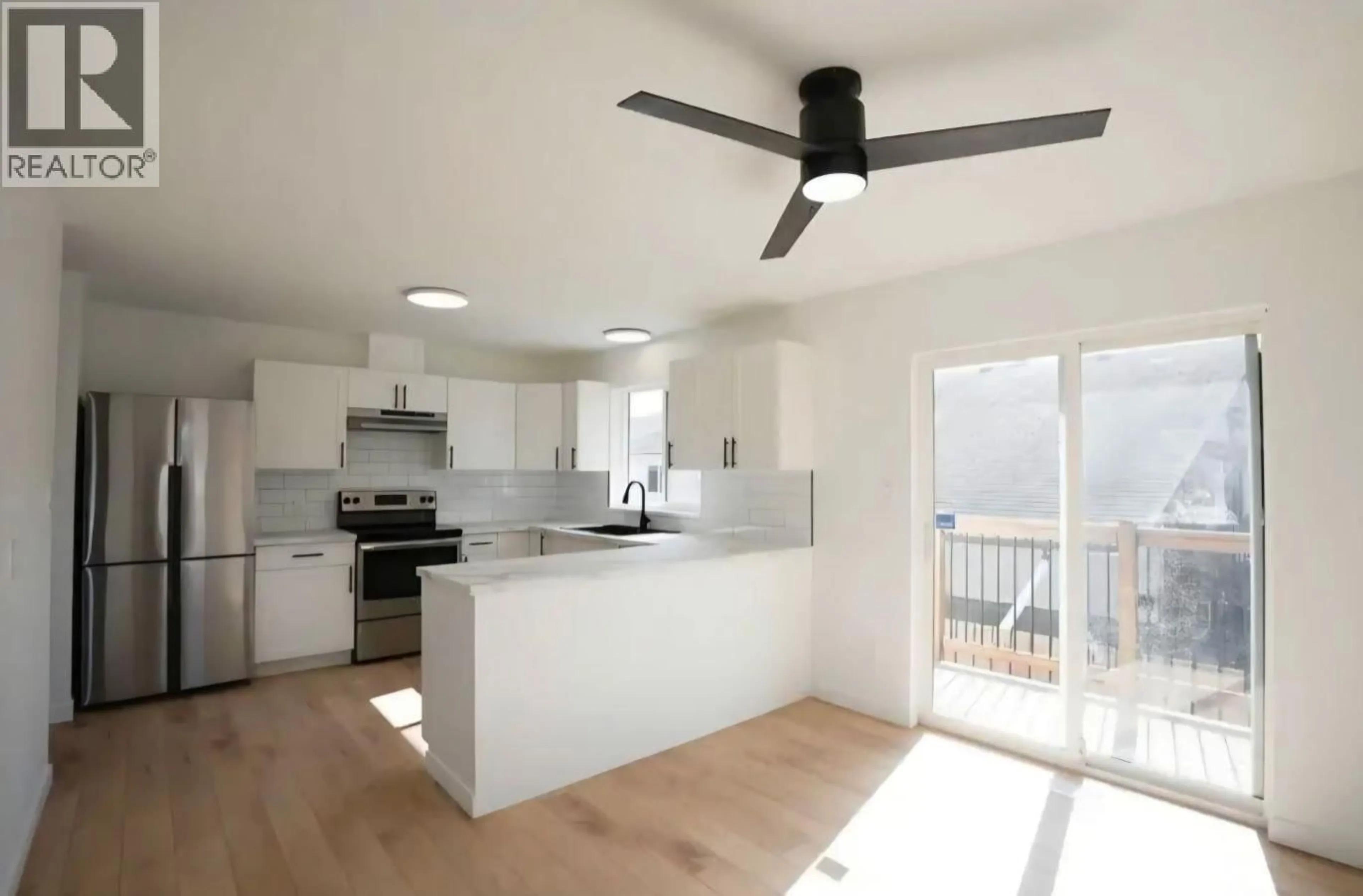 Open concept kitchen, wood/laminate floor for 1497 MCCULLAGH AVENUE, Prince George British Columbia V2L5A3