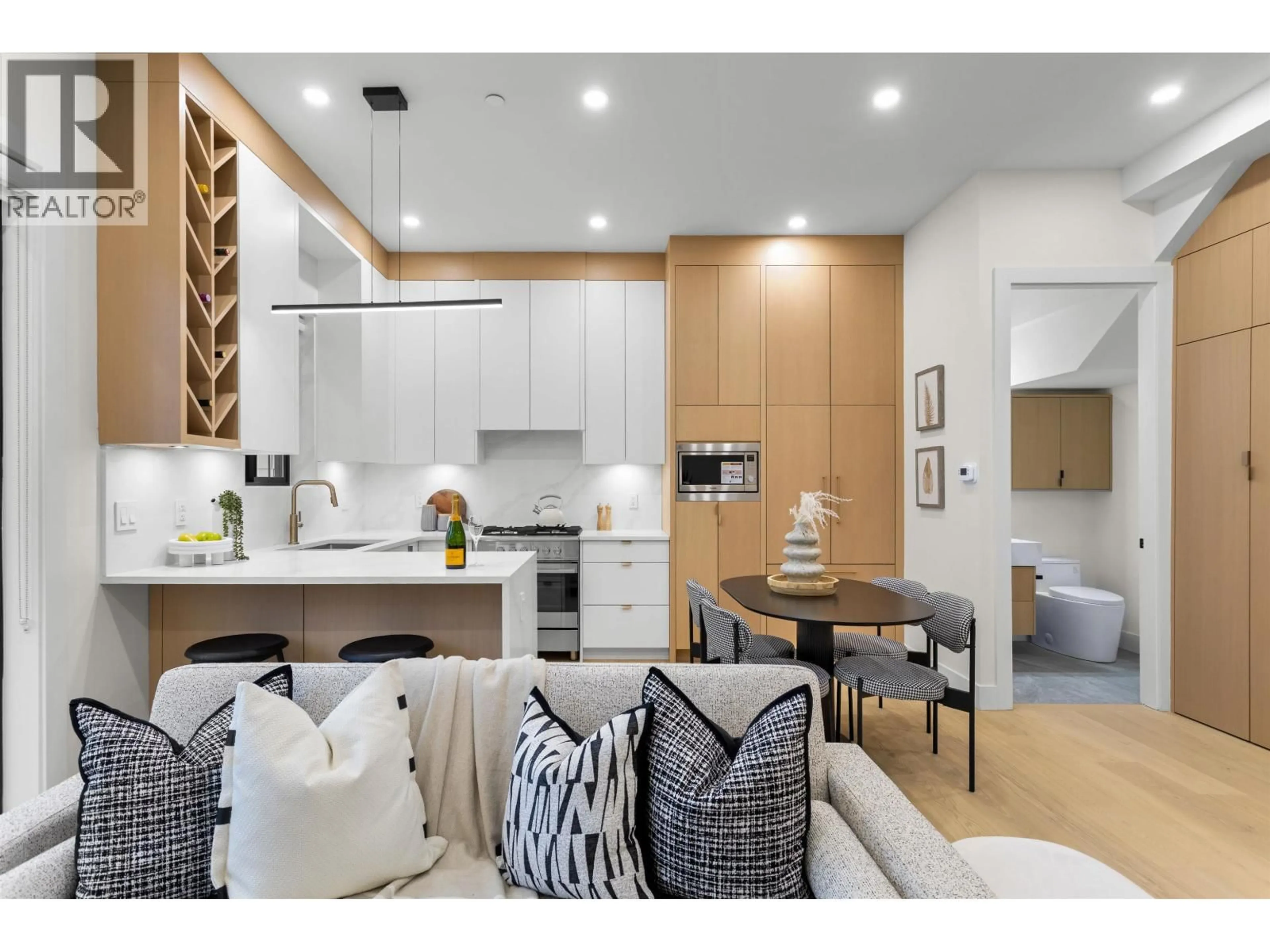 Open concept kitchen, wood/laminate floor for 2 - 5306 CULLODEN STREET, Vancouver British Columbia V5W3R6