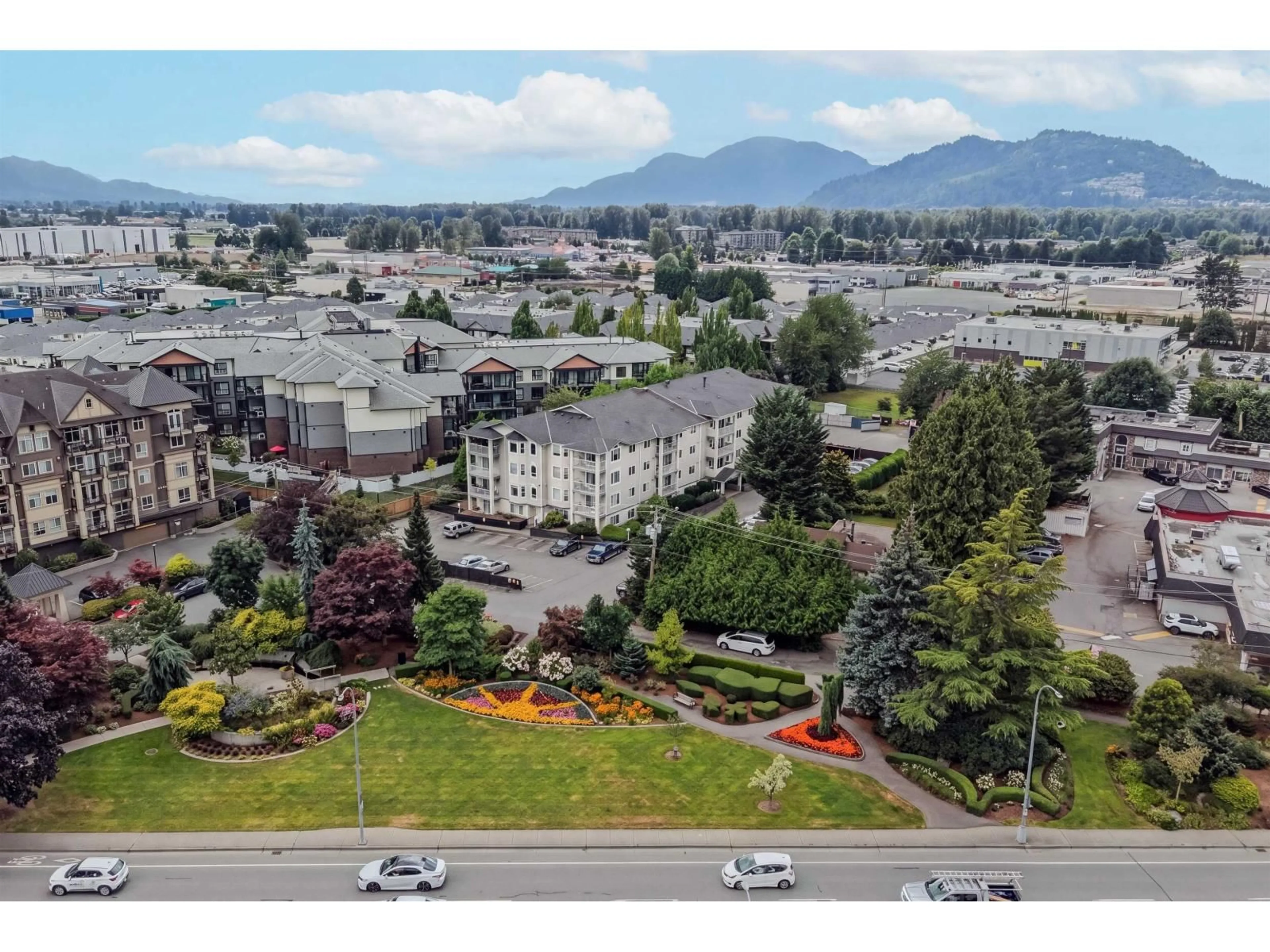 A pic from outside/outdoor area/front of a property/back of a property/a pic from drone, mountain view for 408 - 8537 YOUNG ROAD, Chilliwack British Columbia V2P4P2