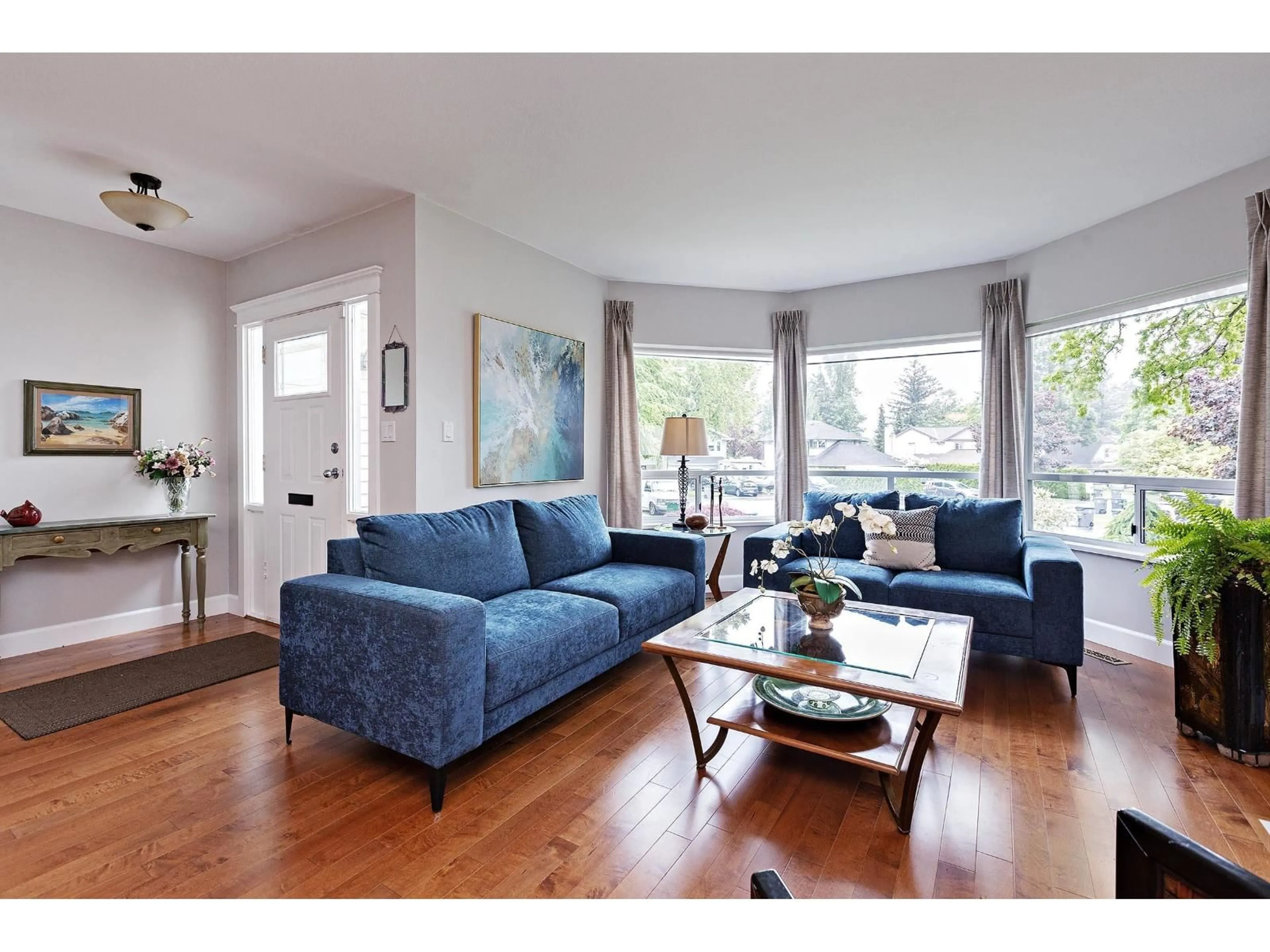 Living room with furniture, wood/laminate floor for 18289 58A AVENUE, Surrey British Columbia V3S7G1