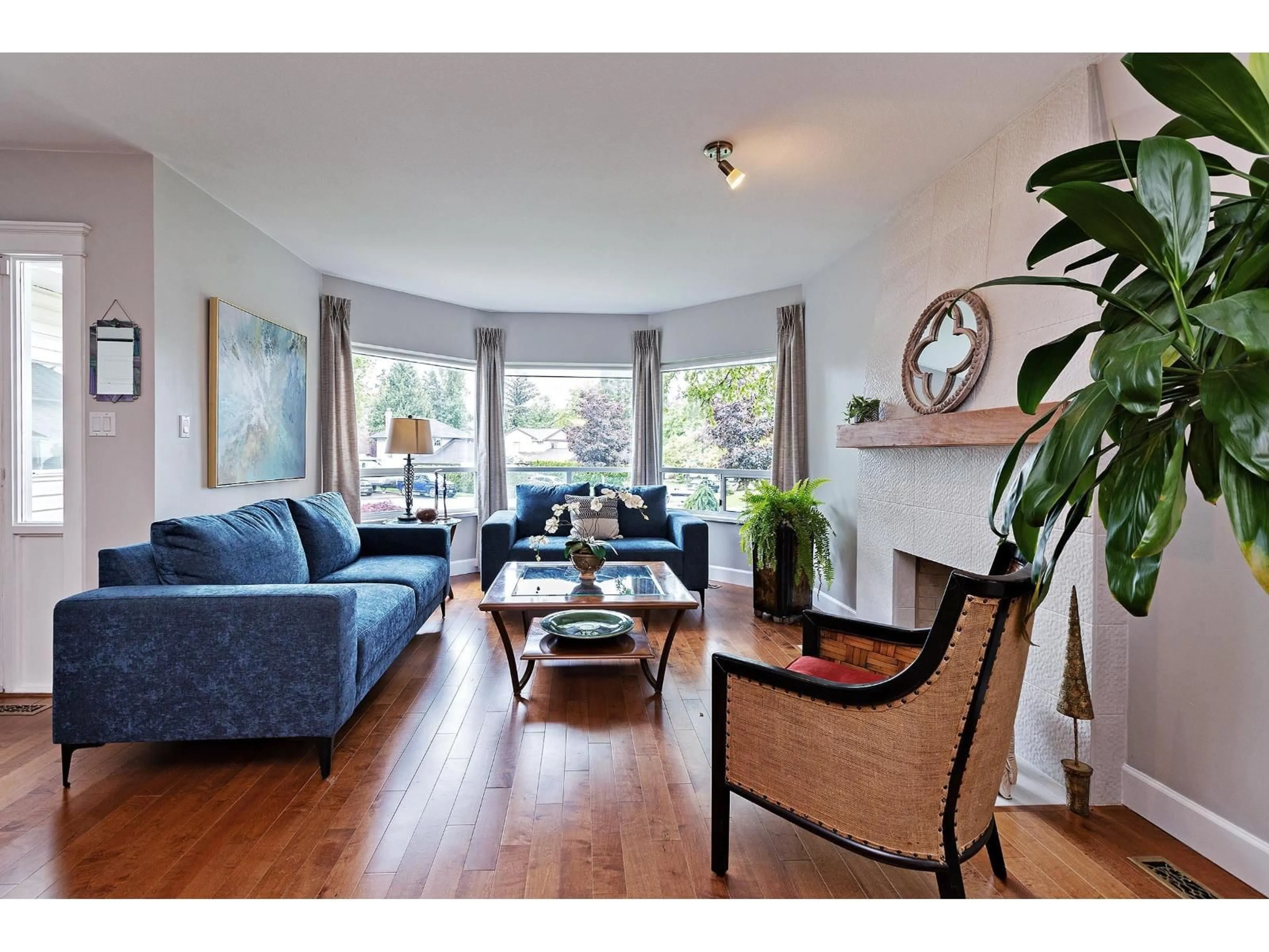 Living room with furniture, wood/laminate floor for 18289 58A AVENUE, Surrey British Columbia V3S7G1
