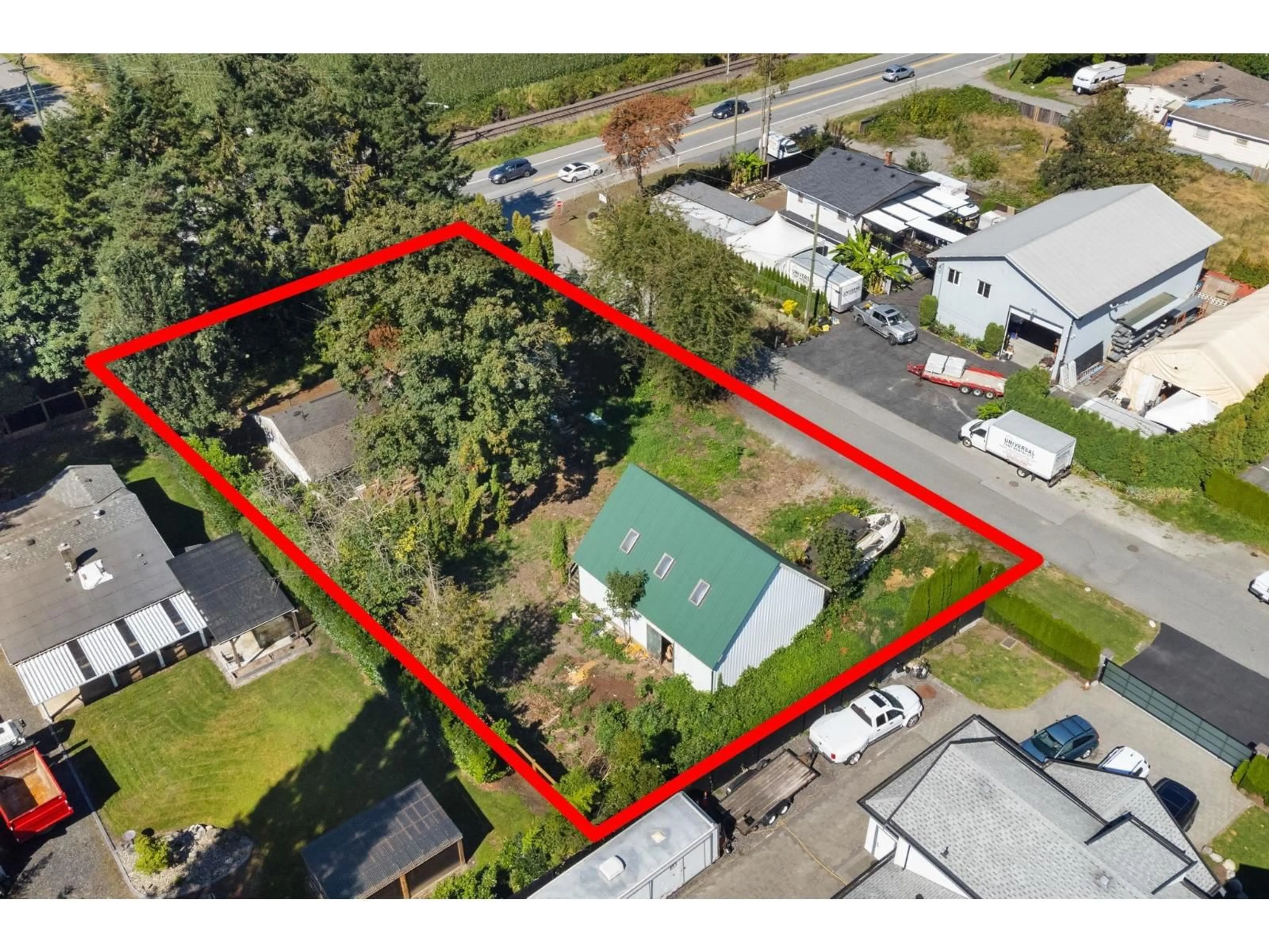 A pic from outside/outdoor area/front of a property/back of a property/a pic from drone, street for 6934 GLOVER ROAD, Langley British Columbia V2Y1X9