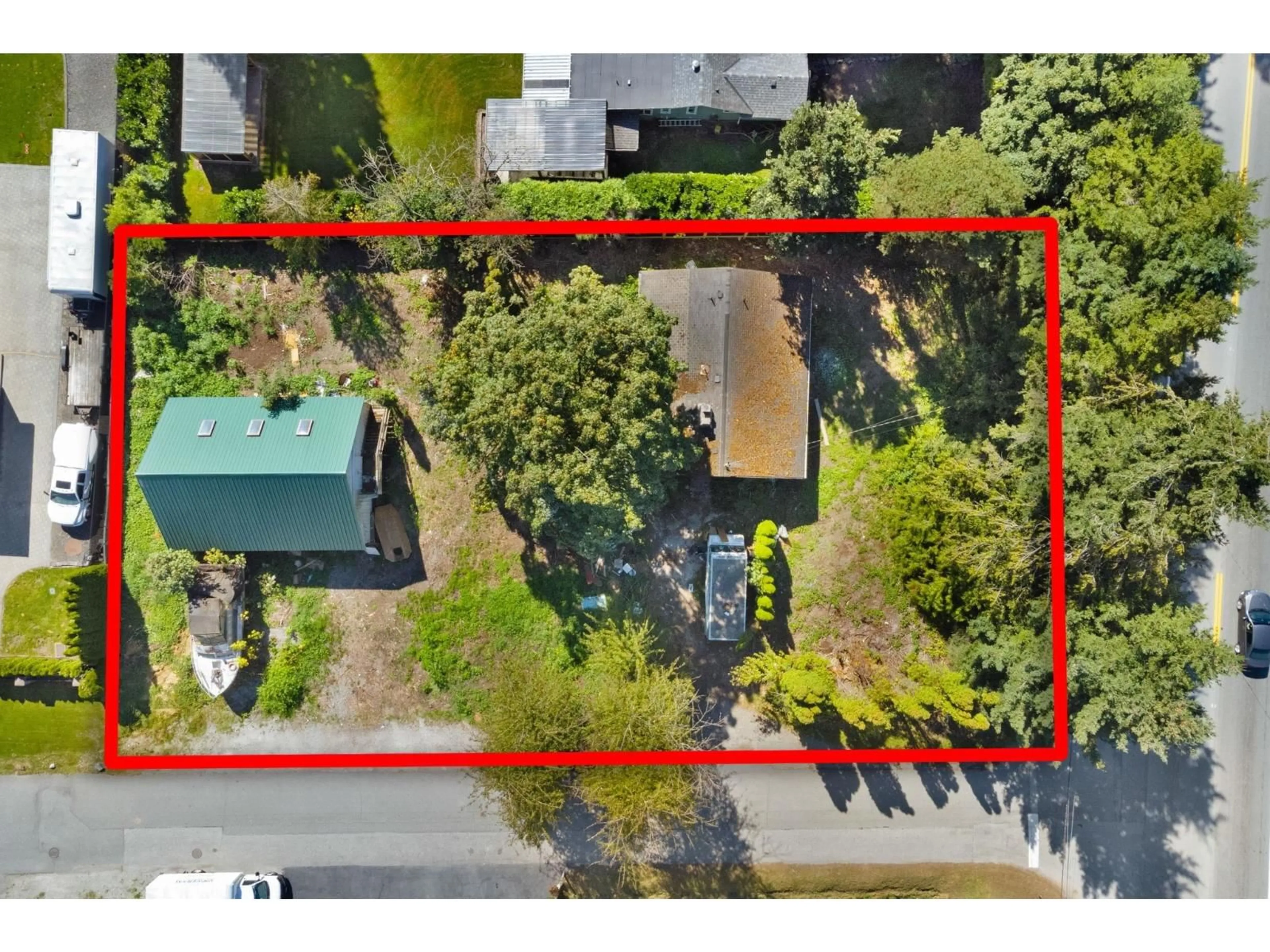 A pic from outside/outdoor area/front of a property/back of a property/a pic from drone, street for 6934 GLOVER ROAD, Langley British Columbia V2Y1X9
