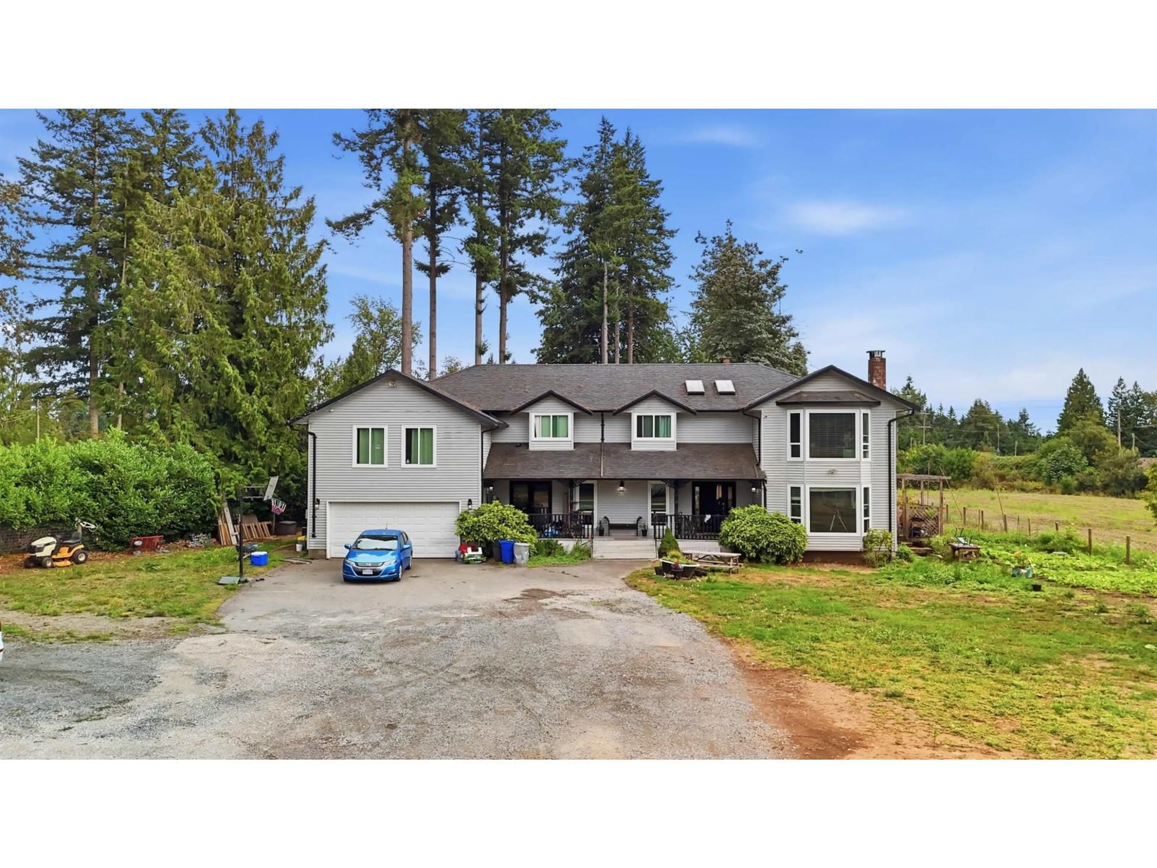 A pic from outside/outdoor area/front of a property/back of a property/a pic from drone, street for 23788 72 AVENUE, Langley British Columbia V1M3K9