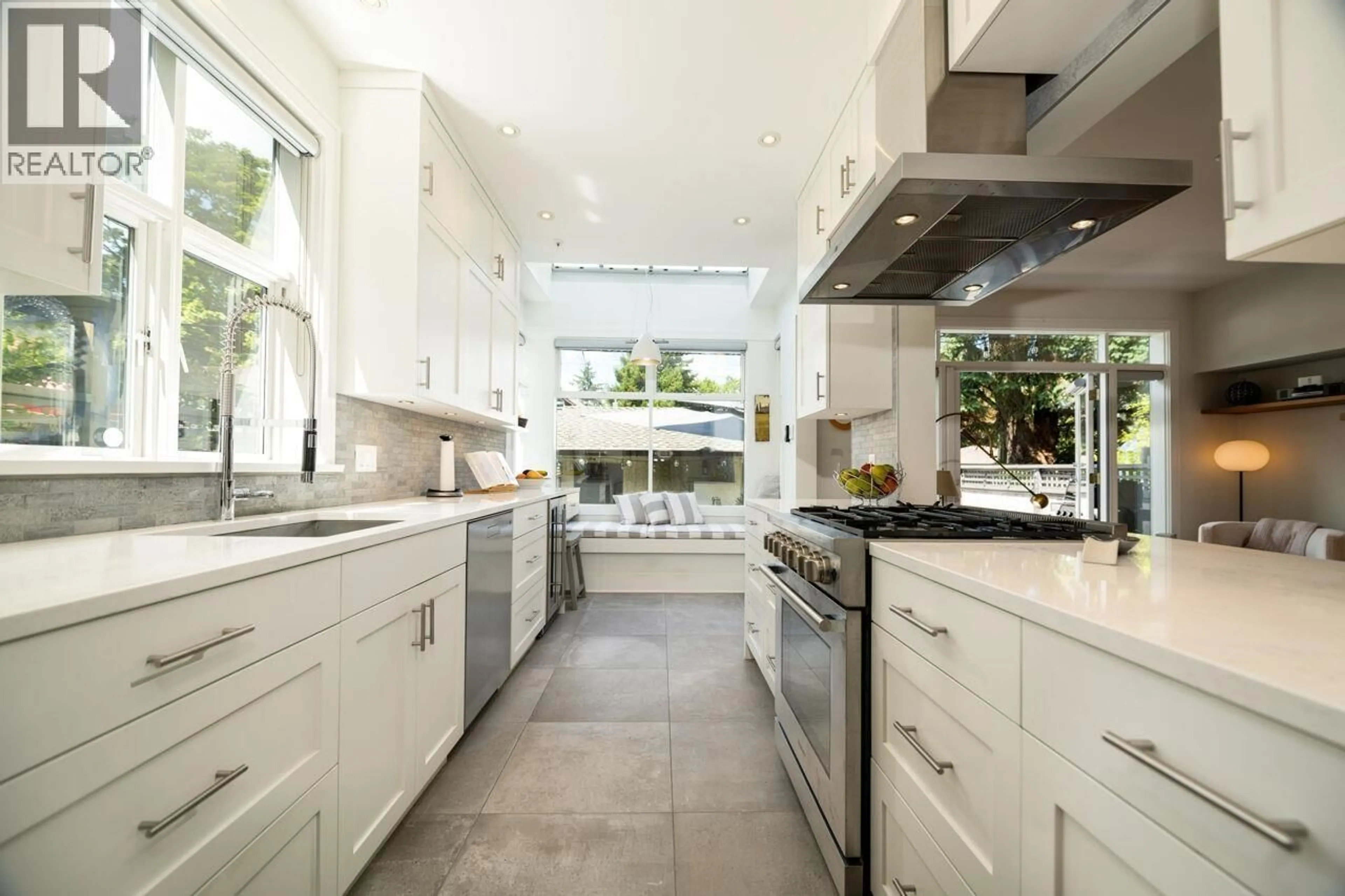 Contemporary kitchen, ceramic/tile floor for 1989 13TH AVENUE, Vancouver British Columbia V6H2H5