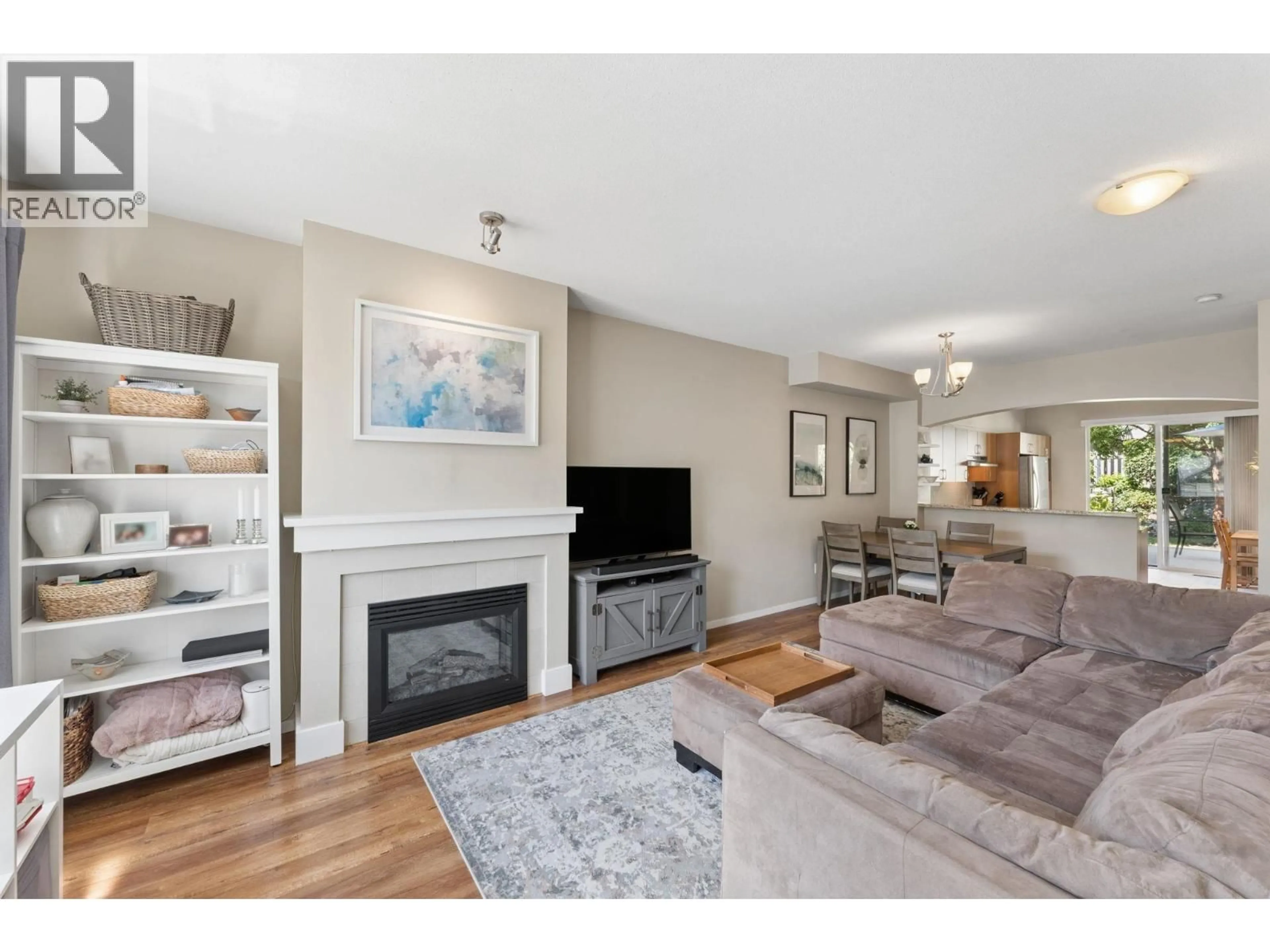 Living room with furniture, wood/laminate floor for 110 - 9088 HALSTON COURT, Burnaby British Columbia V3N0A7