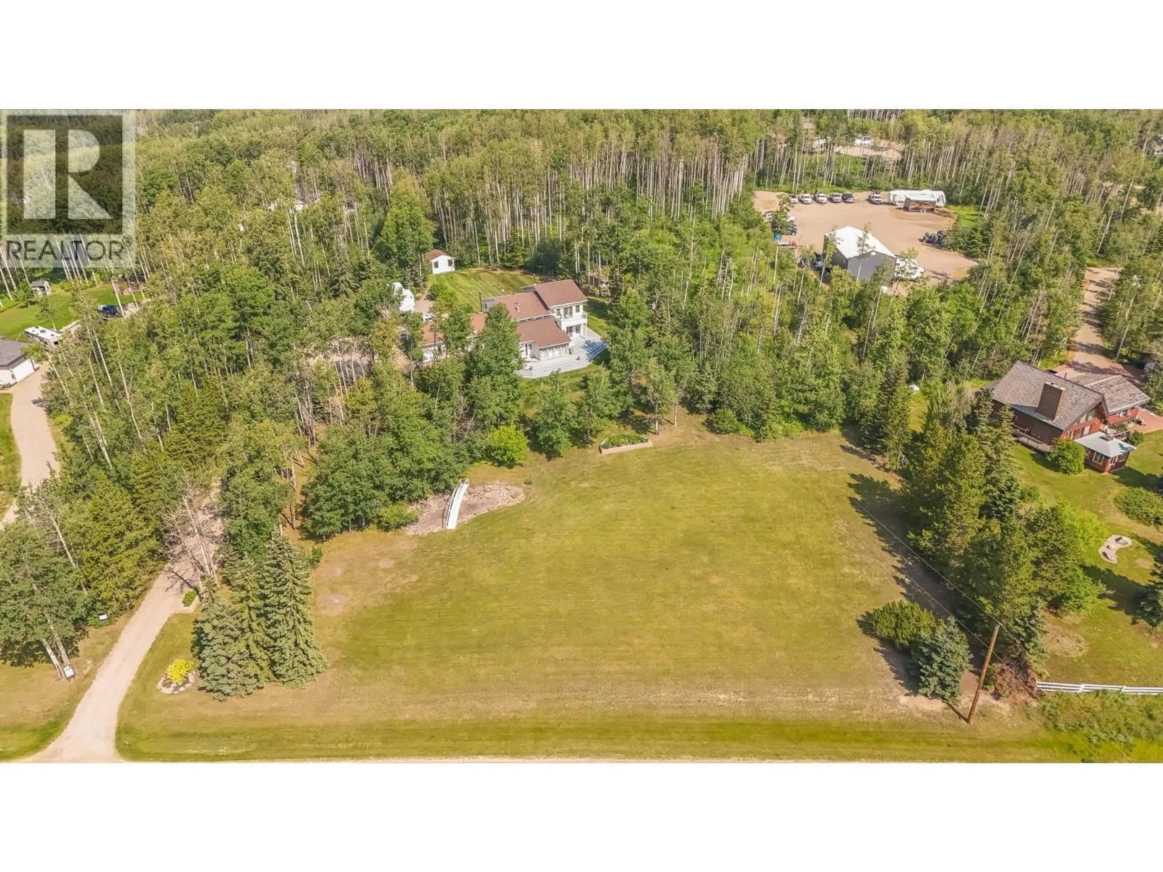 A pic from outside/outdoor area/front of a property/back of a property/a pic from drone, forest/trees view for 13056 TAMARACK AVENUE, Charlie Lake British Columbia V1J8G6