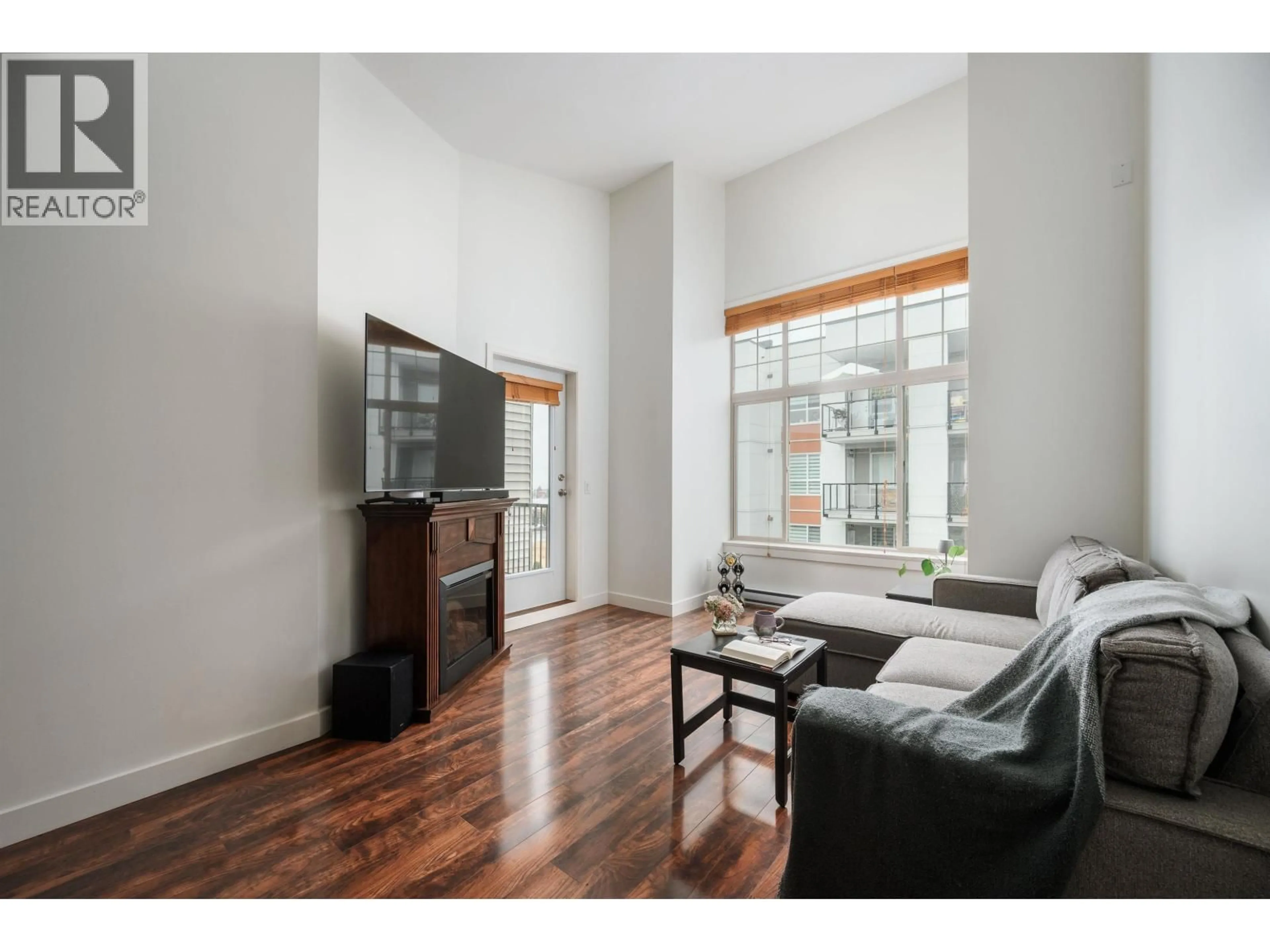 Living room with furniture, wood/laminate floor for 414 - 11887 BURNETT STREET, Maple Ridge British Columbia V2W6P6