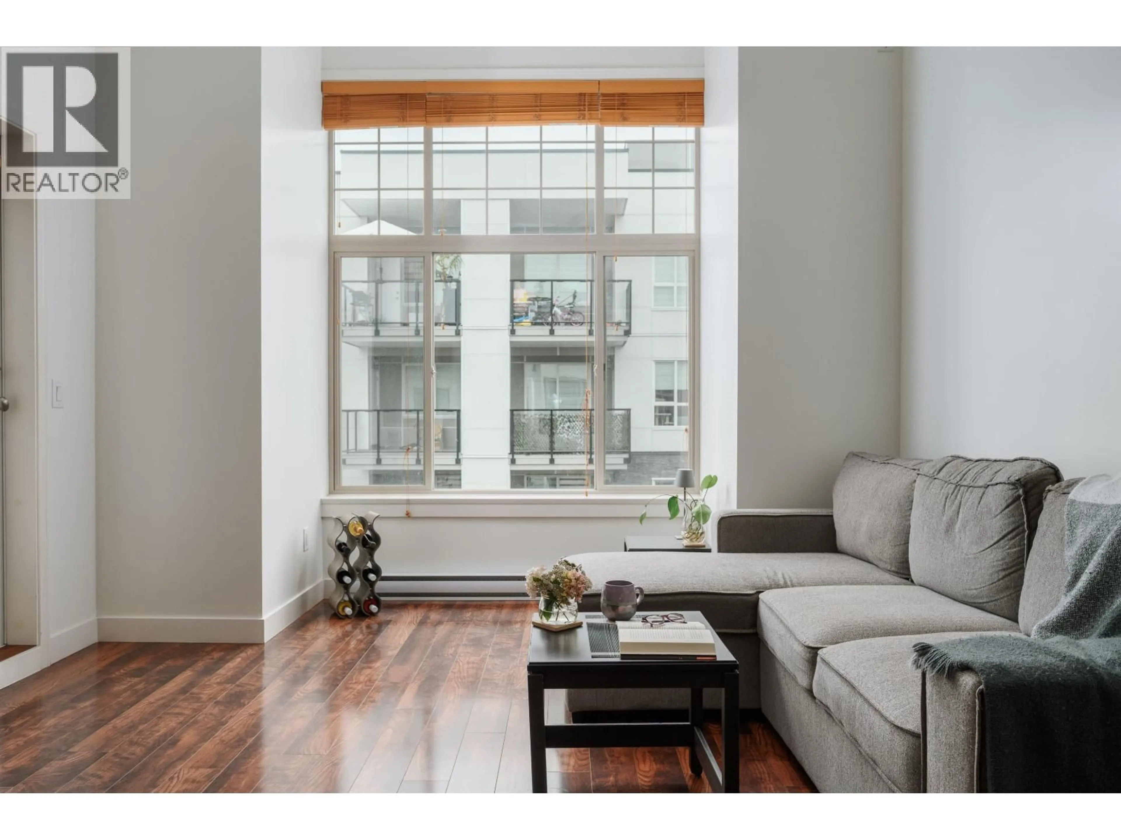 Living room with furniture, wood/laminate floor for 414 - 11887 BURNETT STREET, Maple Ridge British Columbia V2W6P6
