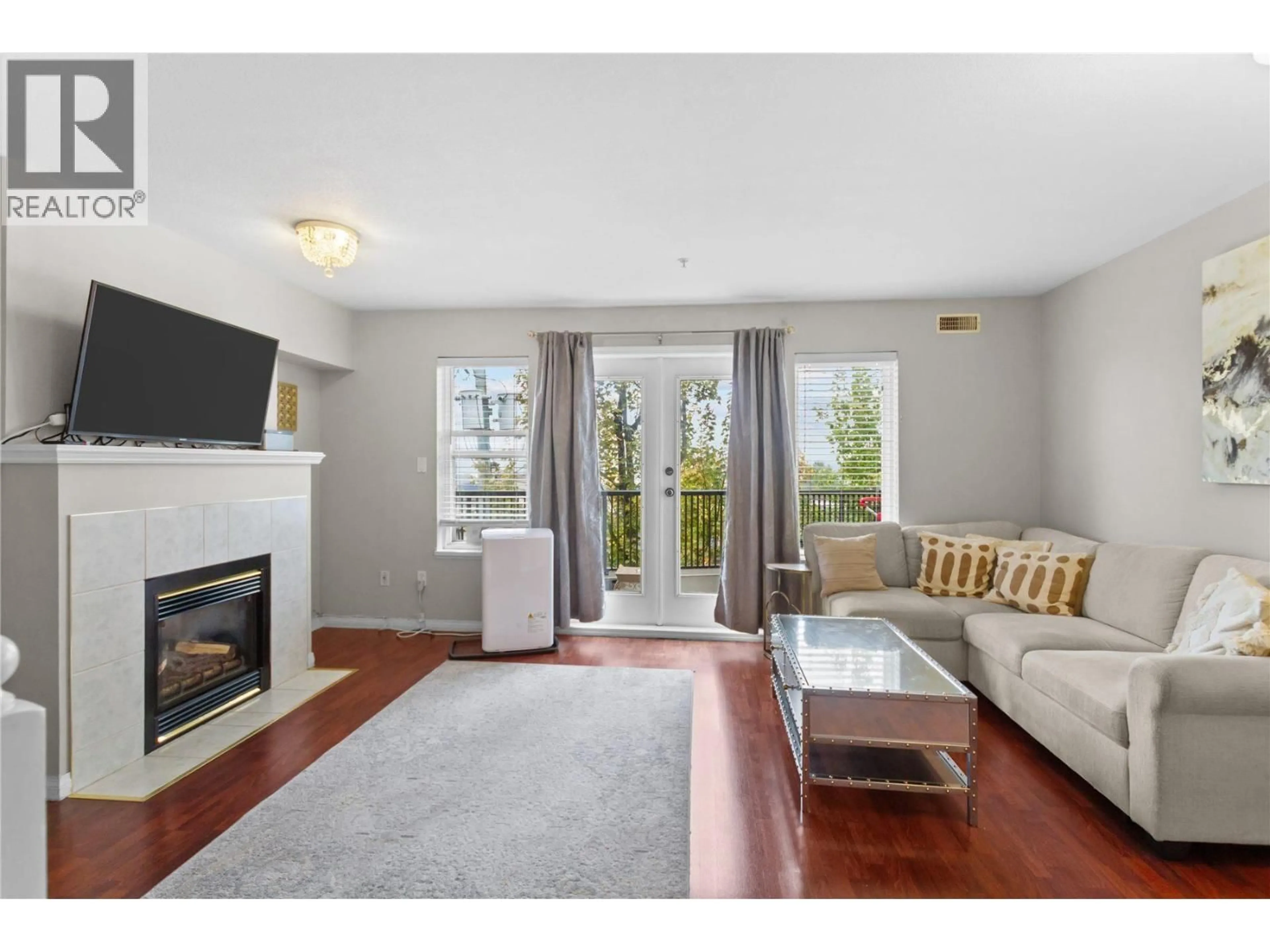 Living room with furniture, wood/laminate floor for 22 - 205 LEBLEU STREET, Coquitlam British Columbia V3K6Z5