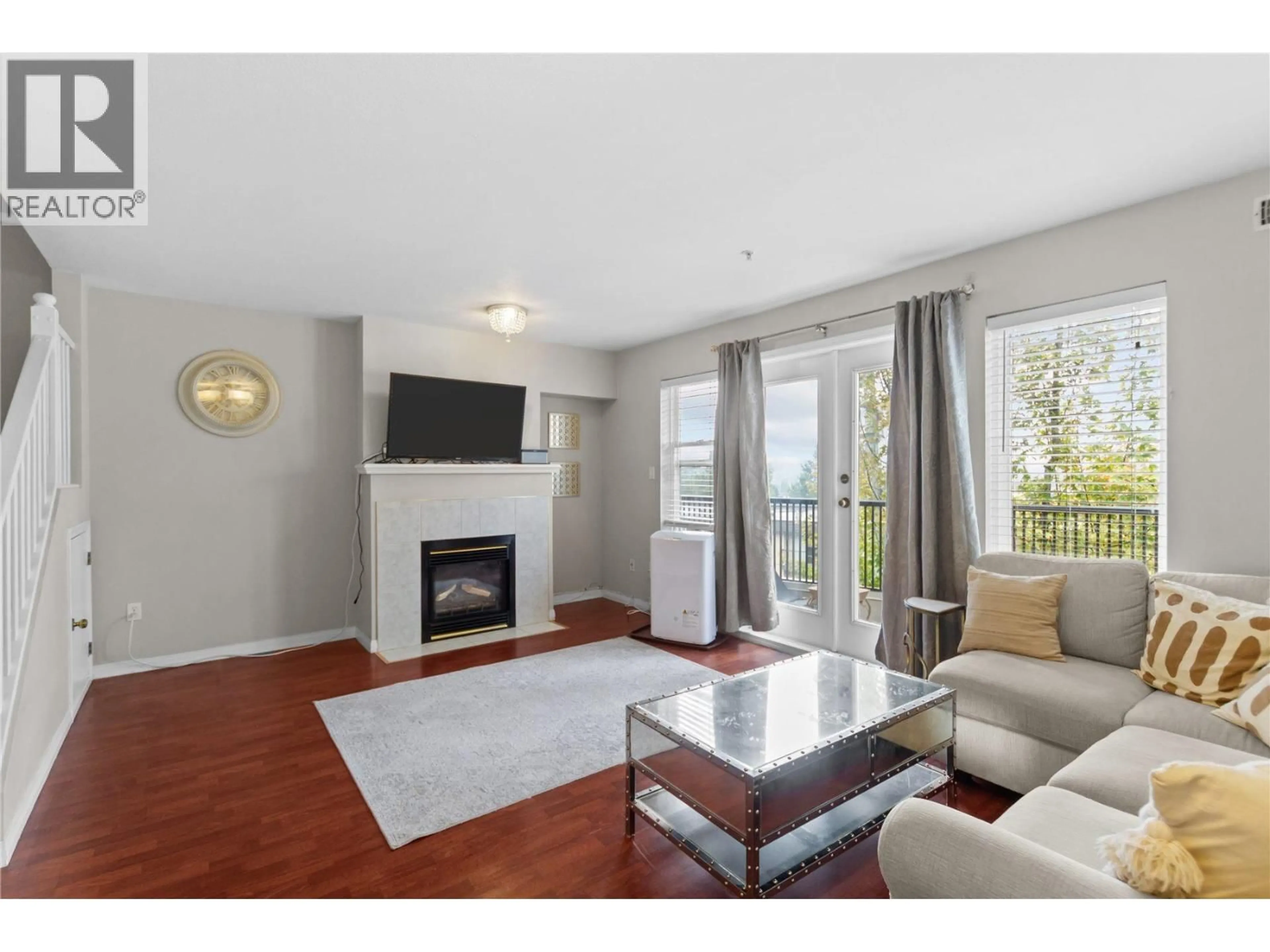Living room with furniture, wood/laminate floor for 22 - 205 LEBLEU STREET, Coquitlam British Columbia V3K6Z5