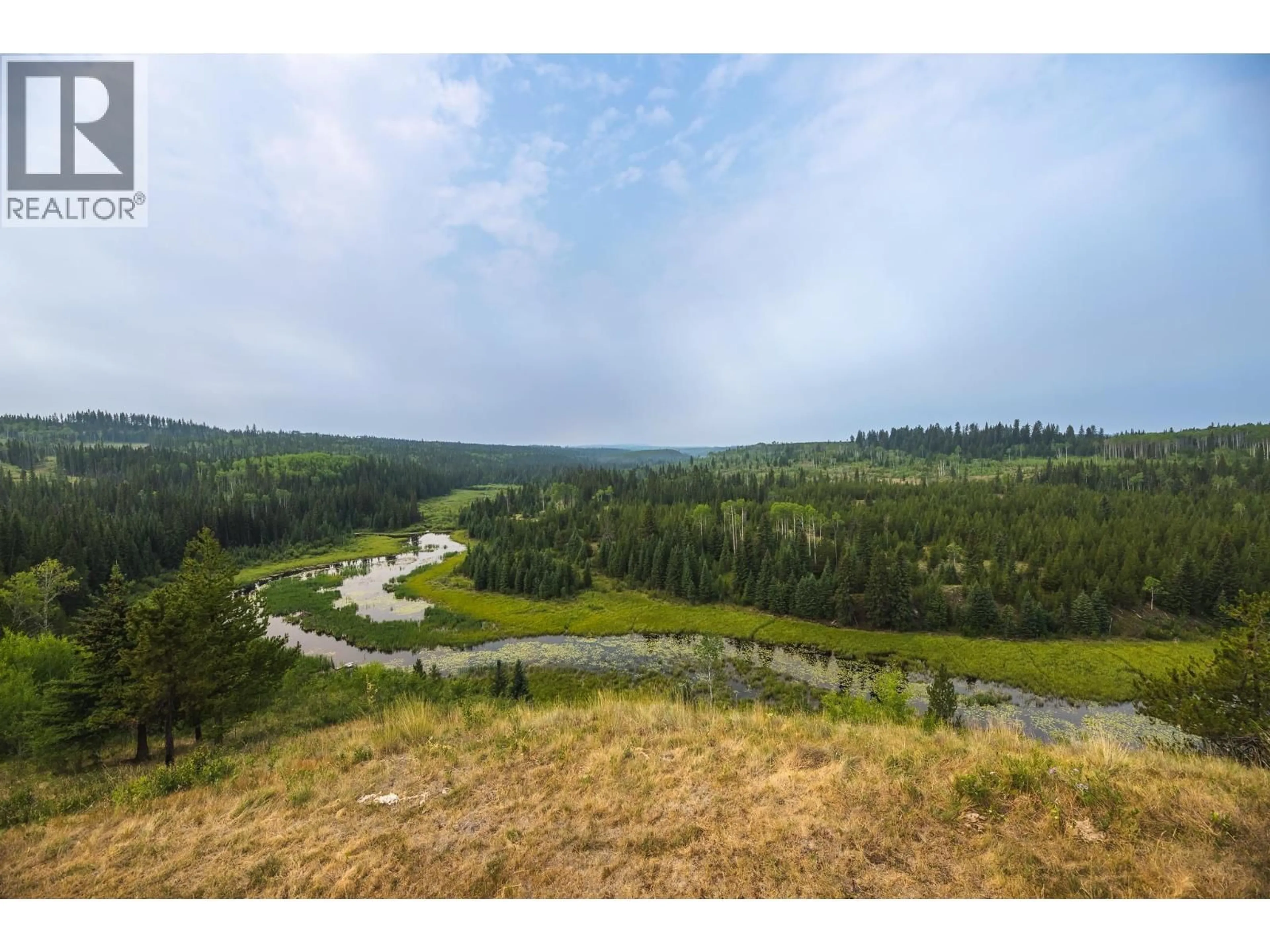 A pic from outside/outdoor area/front of a property/back of a property/a pic from drone, water/lake/river/ocean view for 7585 BONAPARTE ROAD, Bridge Lake British Columbia V0K1E0