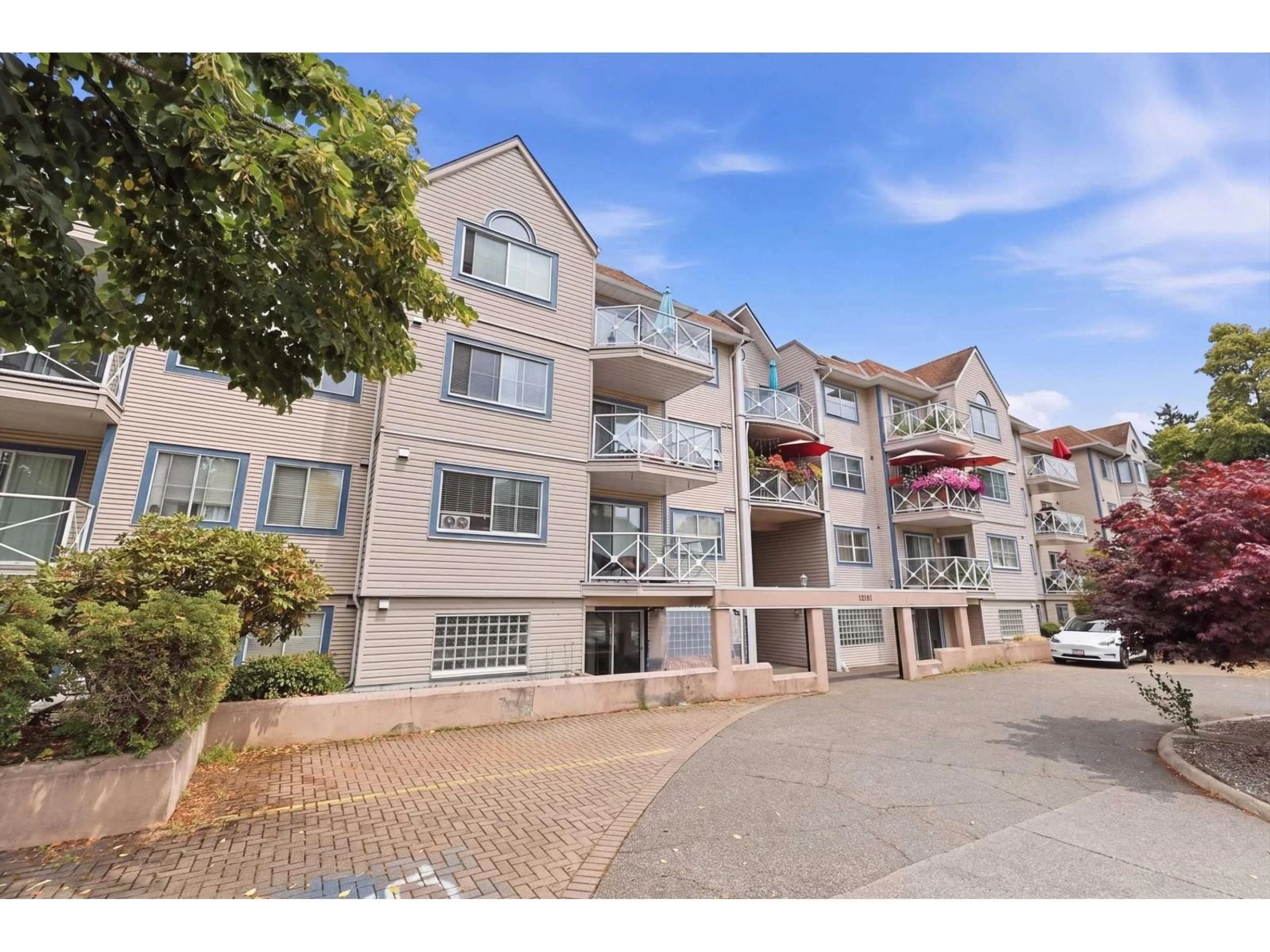 A pic from outside/outdoor area/front of a property/back of a property/a pic from drone, street for 202 - 12101 80 AVENUE, Surrey British Columbia V3W5V6