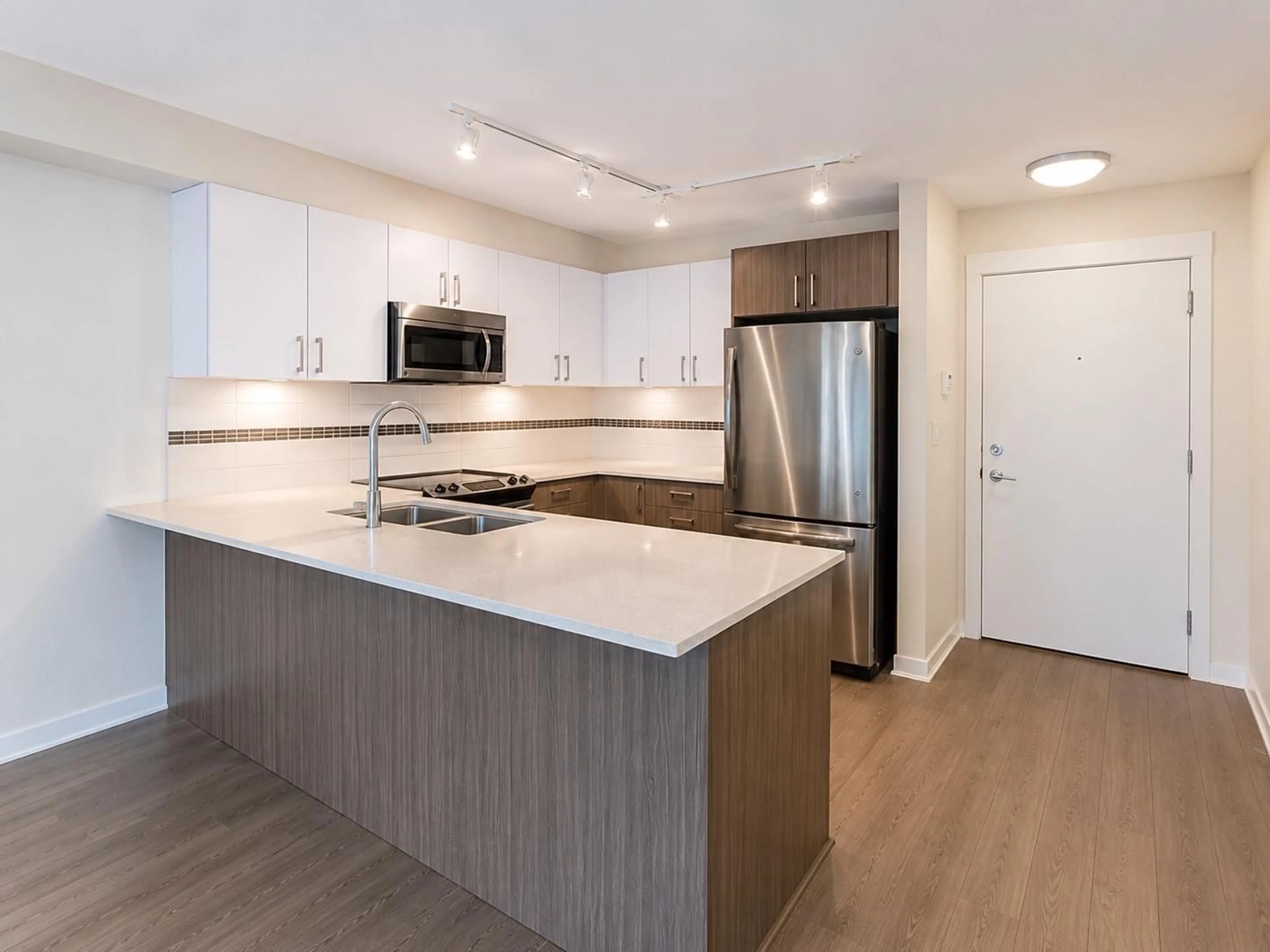 Open concept kitchen, wood/laminate floor for 308 - 8733 160 STREET, Surrey British Columbia V4N6P9