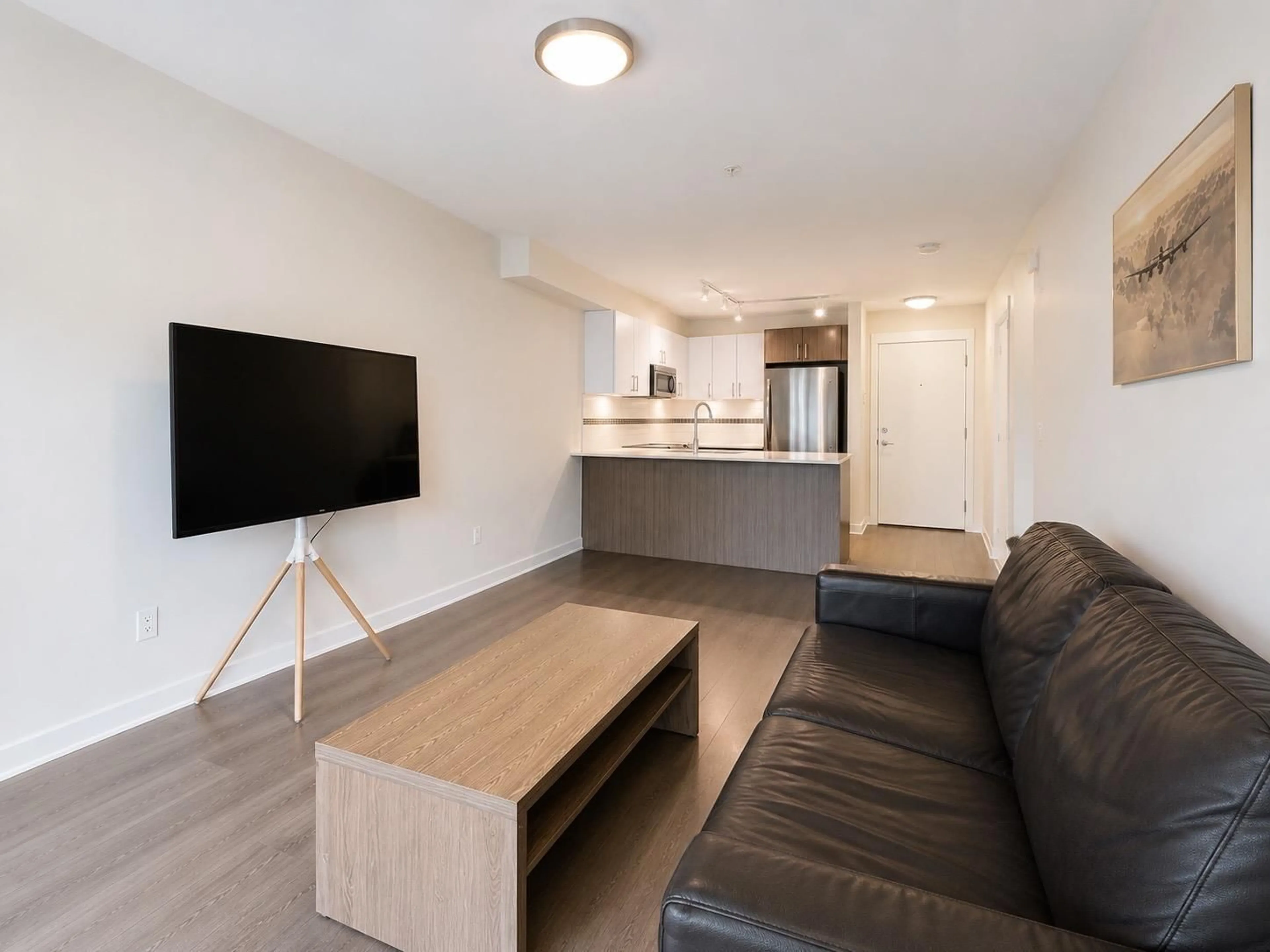 Living room with furniture, wood/laminate floor for 308 - 8733 160 STREET, Surrey British Columbia V4N6P9