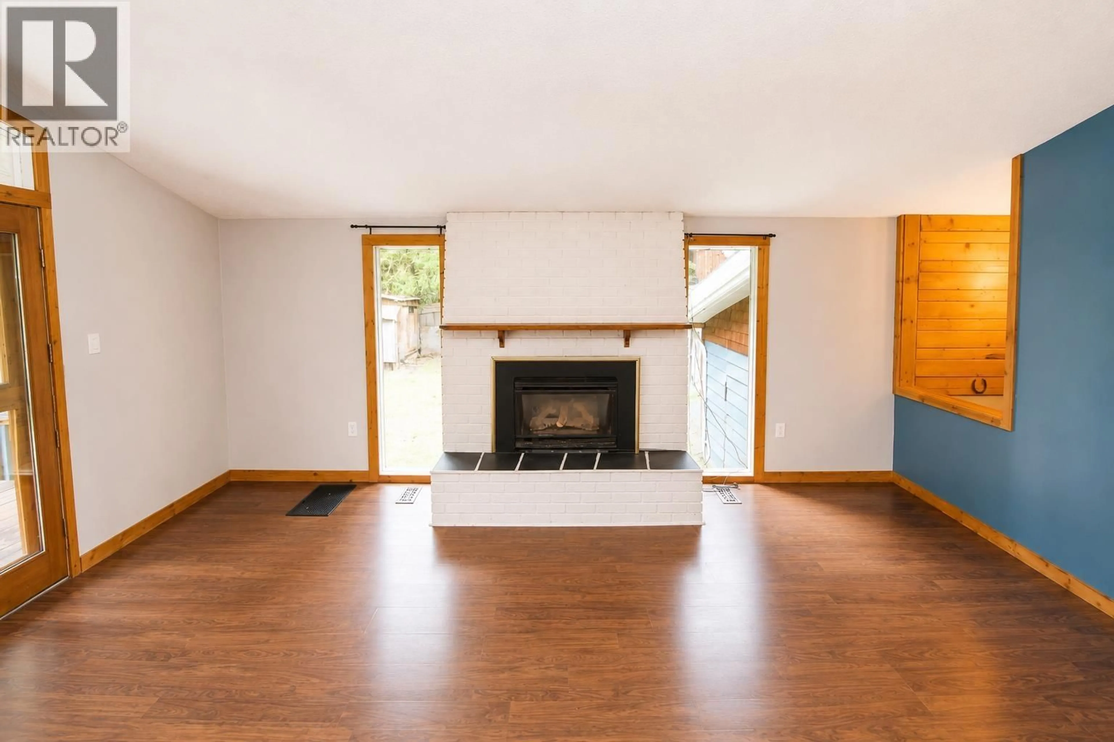 Living room with furniture, wood/laminate floor for 2651 MORGAN ROAD, Houston British Columbia V0J1Z2