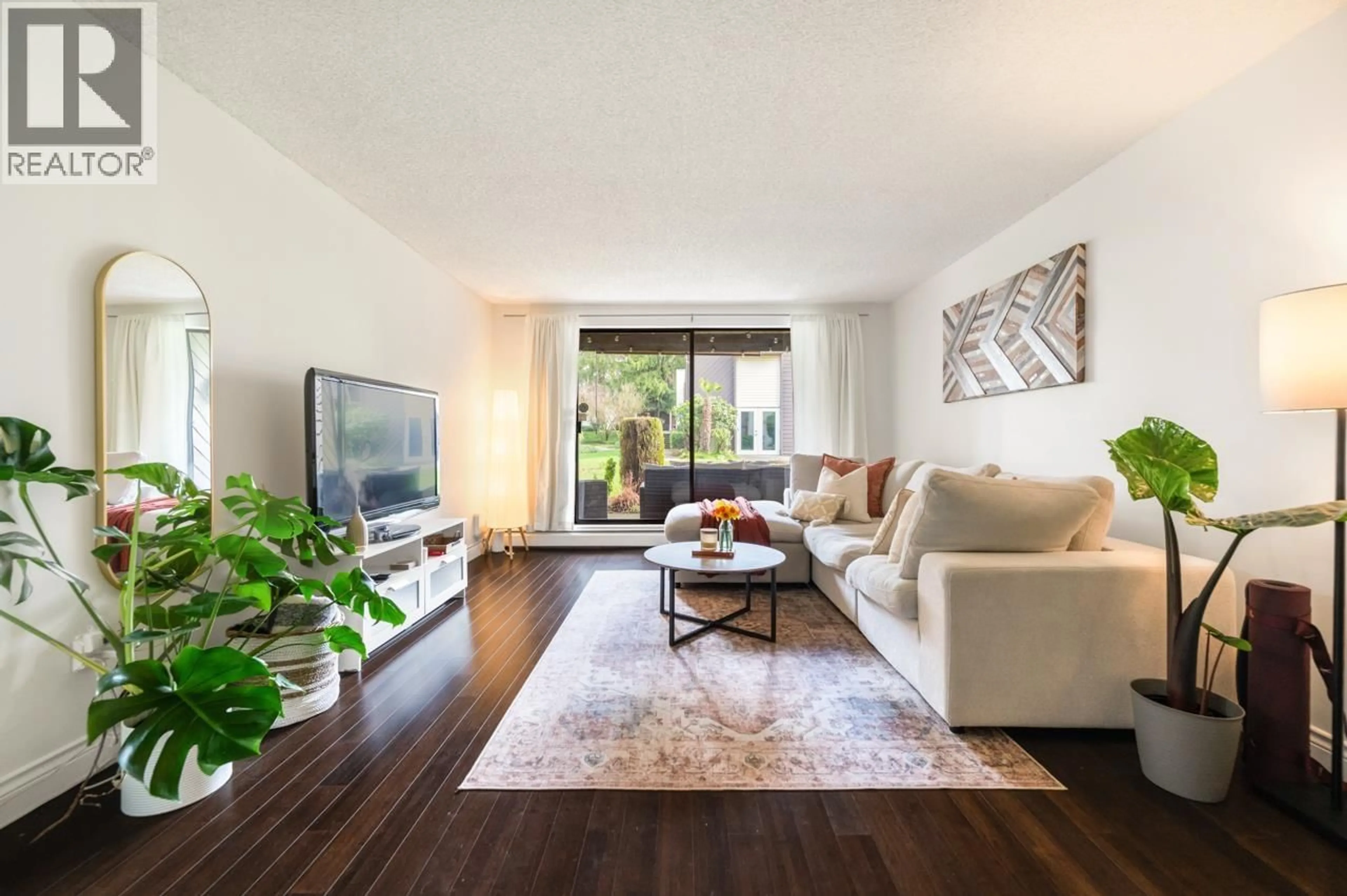 Living room with furniture, wood/laminate floor for 119 - 3911 CARRIGAN COURT, Burnaby British Columbia V3N4J7